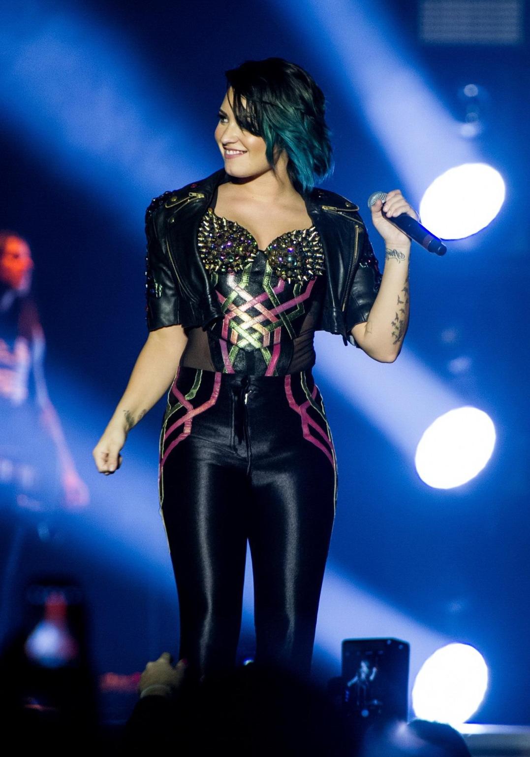 16P Demi Lovato wearing tights and spiky corset on stage in Birmingham