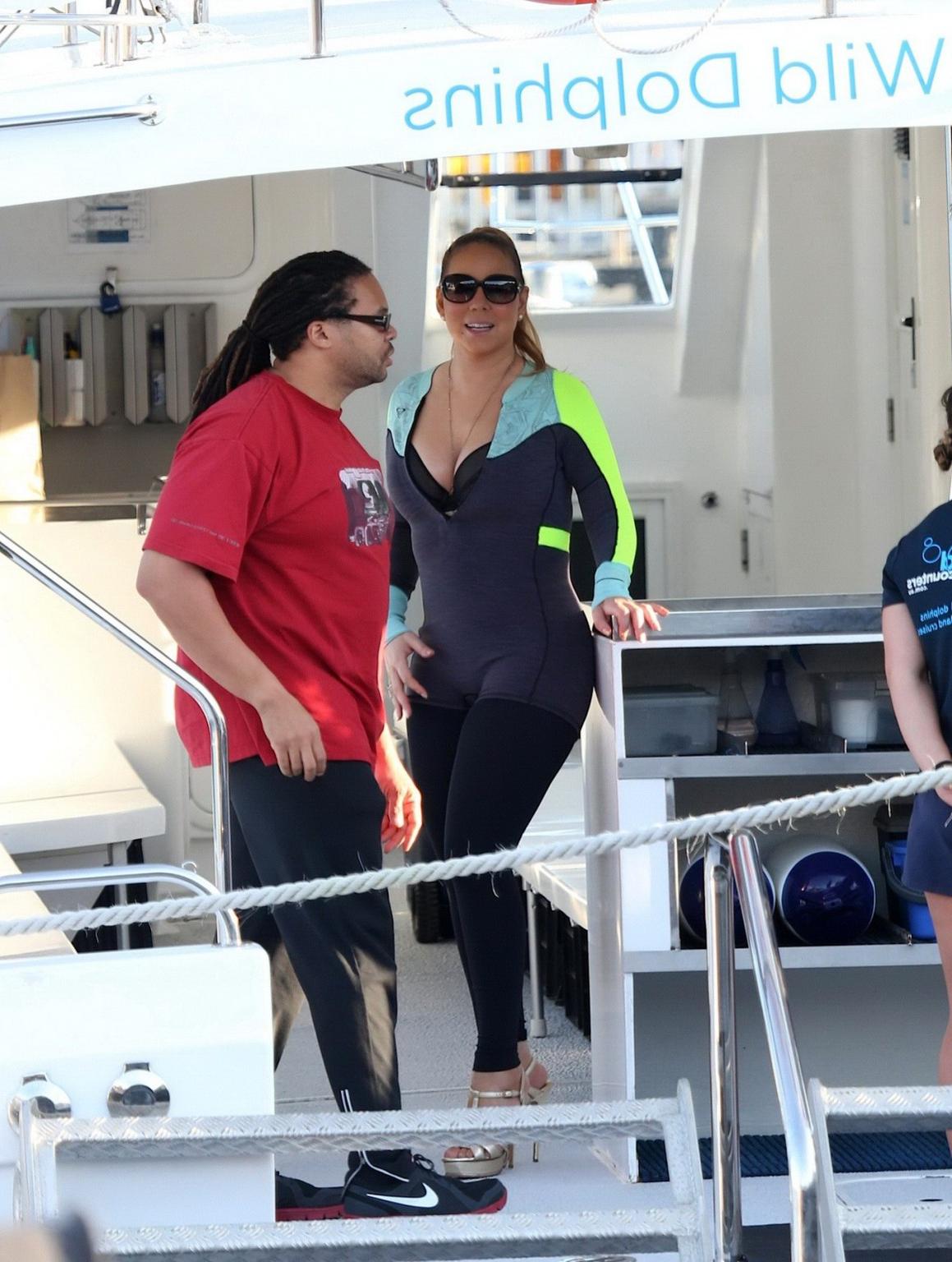 16P Busty Mariah Carey wearing bikini top and wet suit for a boat ride in Perth