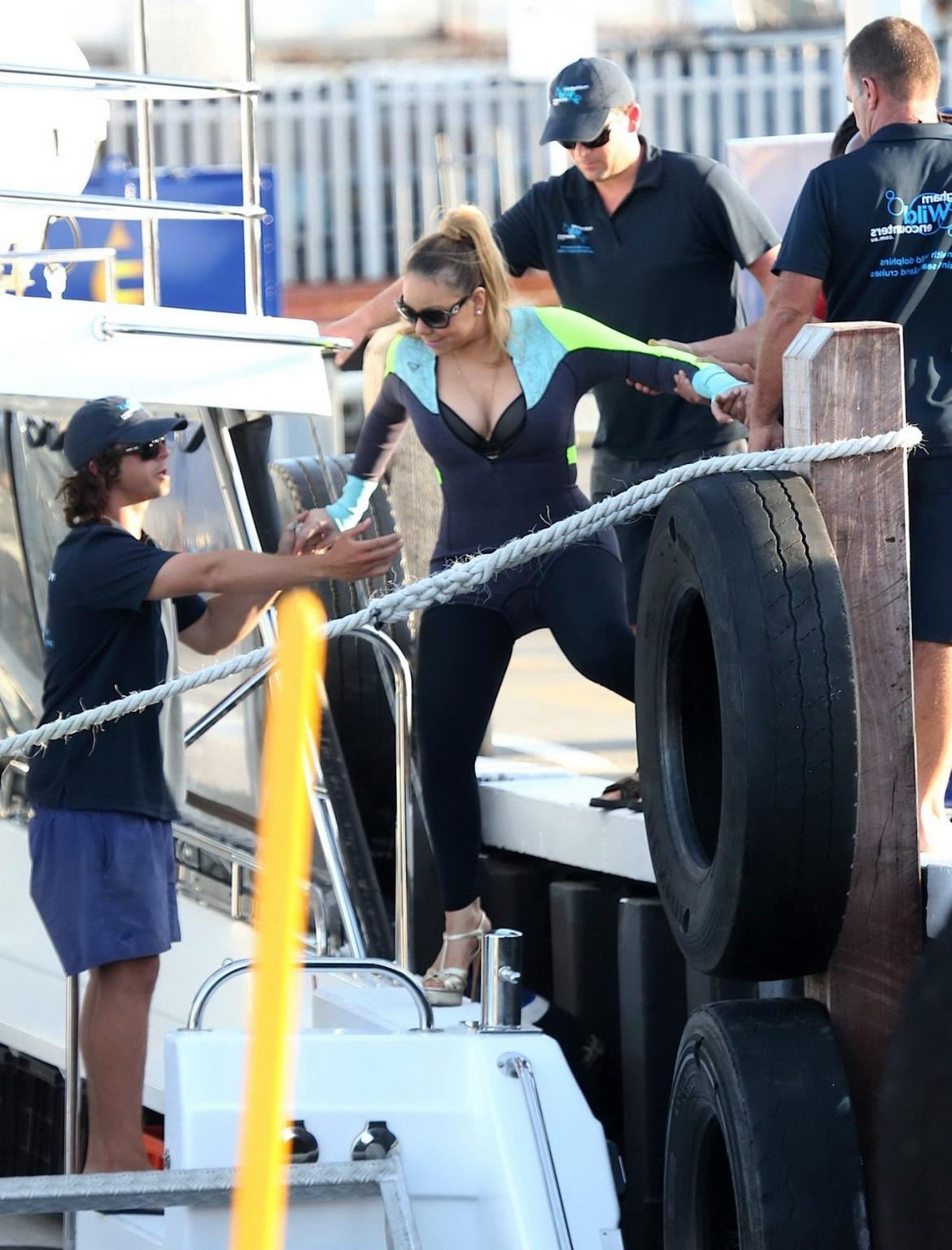 16P Busty Mariah Carey wearing bikini top and wet suit for a boat ride in Perth