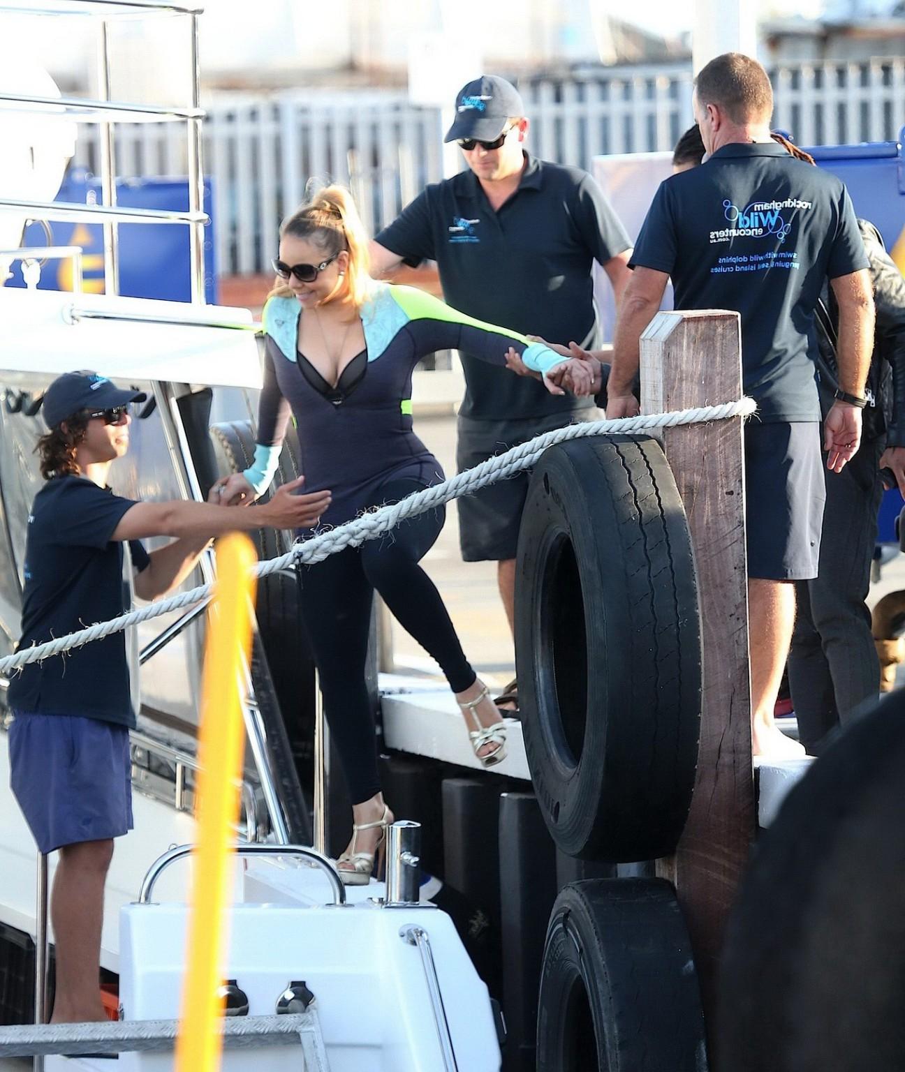 16P Busty Mariah Carey wearing bikini top and wet suit for a boat ride in Perth