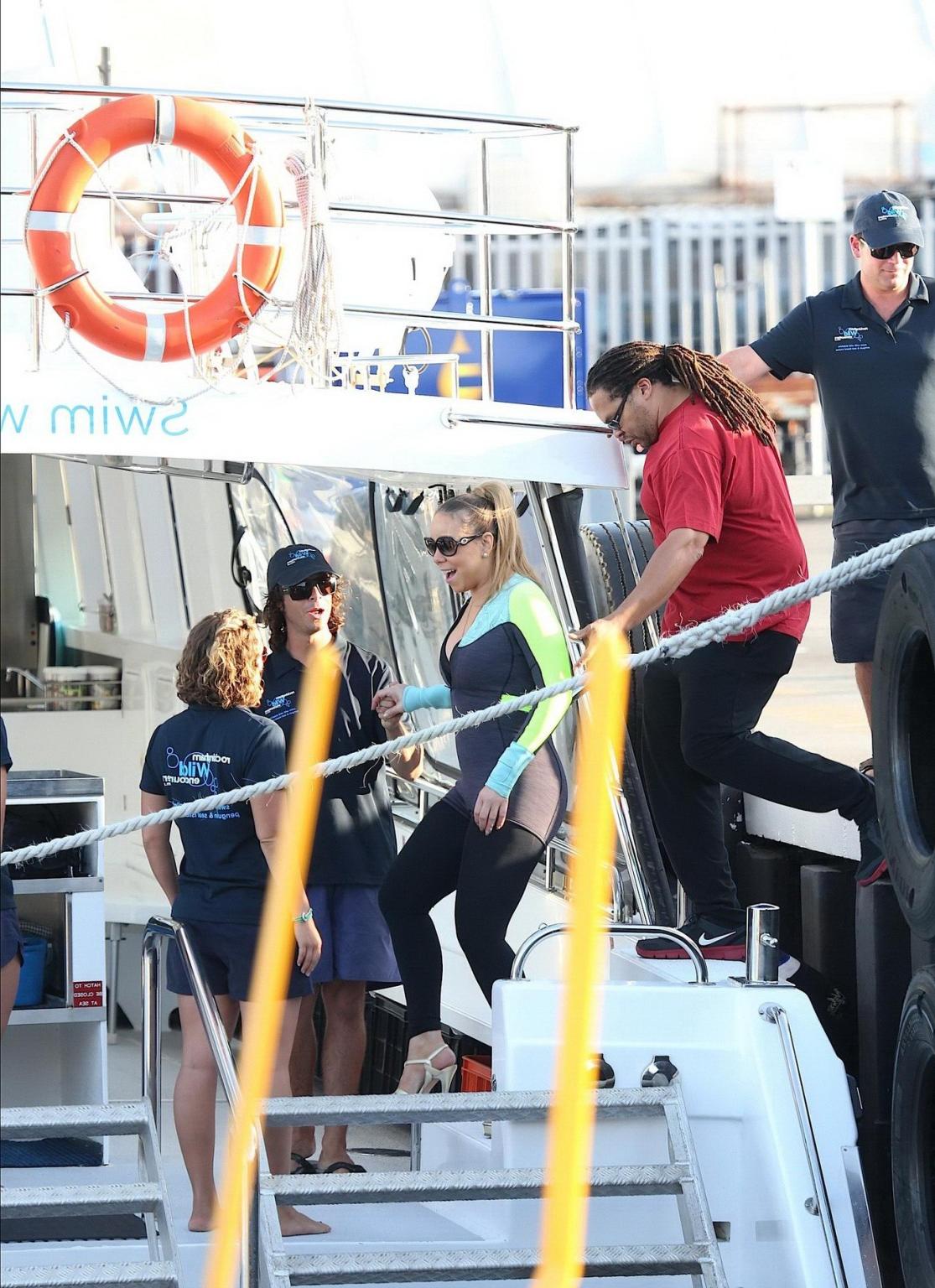 16P Busty Mariah Carey wearing bikini top and wet suit for a boat ride in Perth