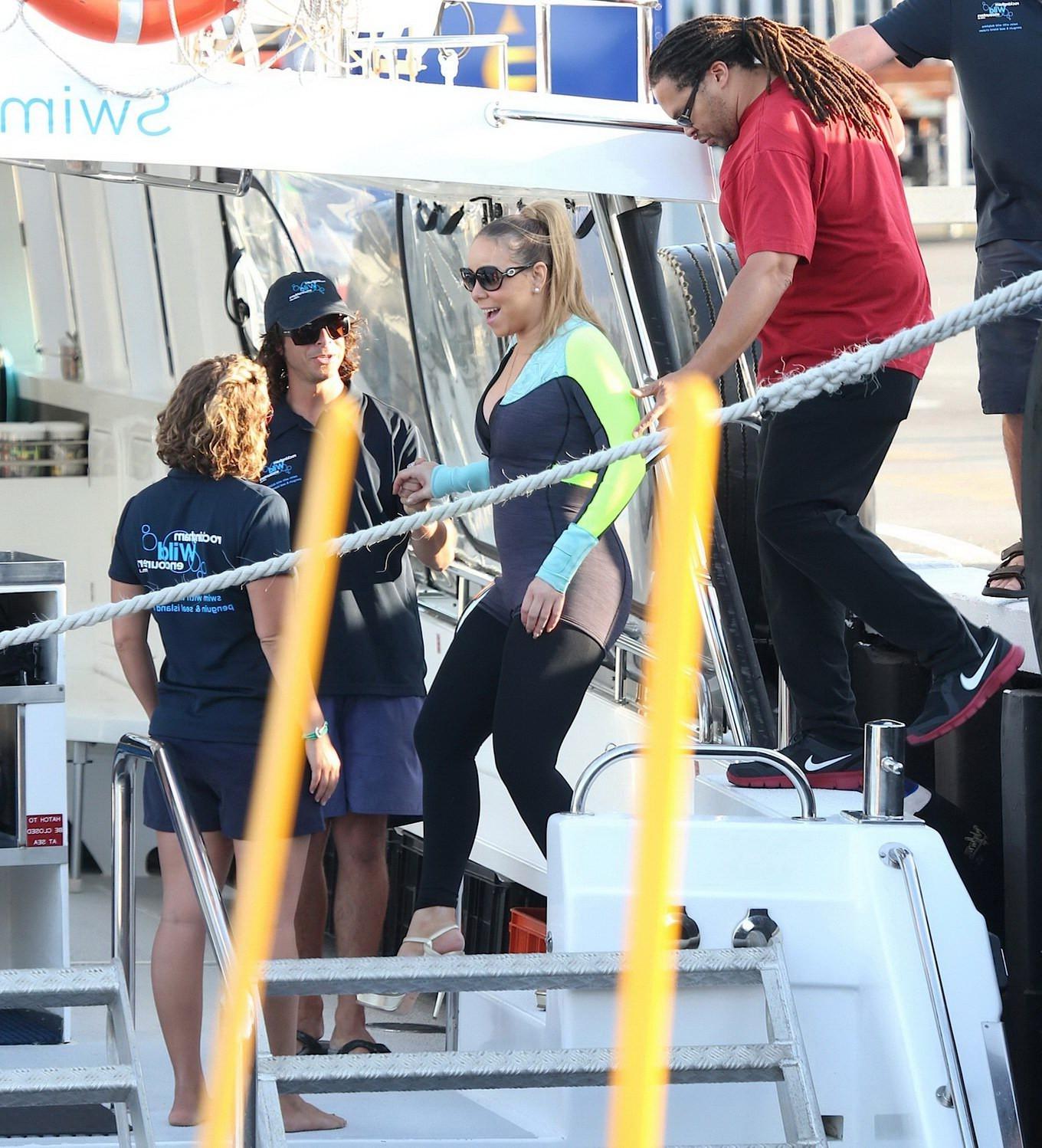 16P Busty Mariah Carey wearing bikini top and wet suit for a boat ride in Perth