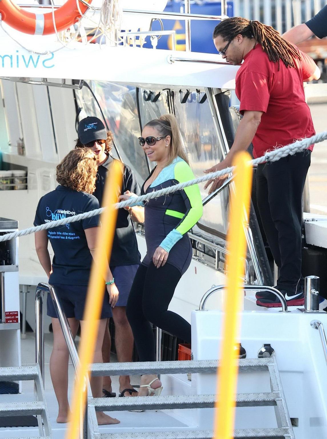 16P Busty Mariah Carey wearing bikini top and wet suit for a boat ride in Perth