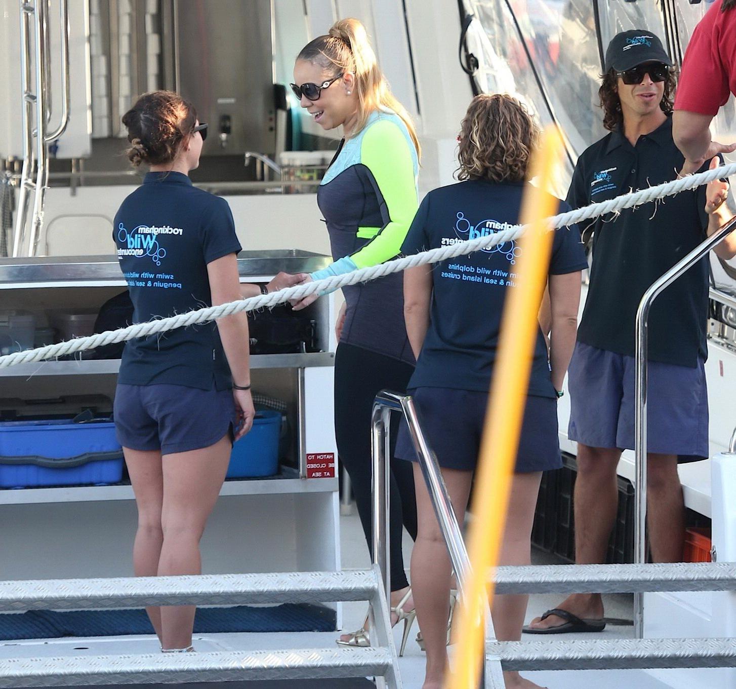 16P Busty Mariah Carey wearing bikini top and wet suit for a boat ride in Perth
