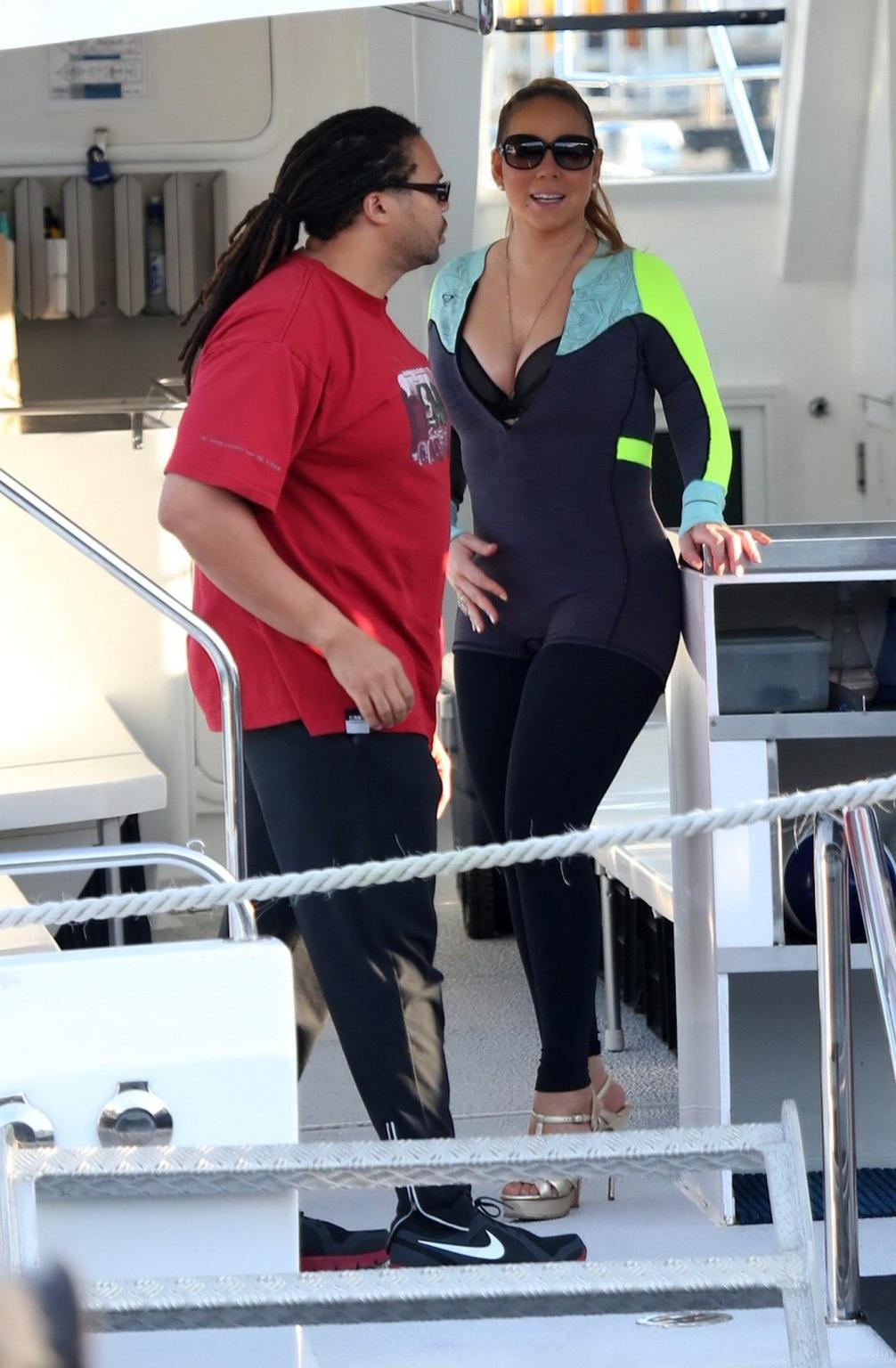 16P Busty Mariah Carey wearing bikini top and wet suit for a boat ride in Perth