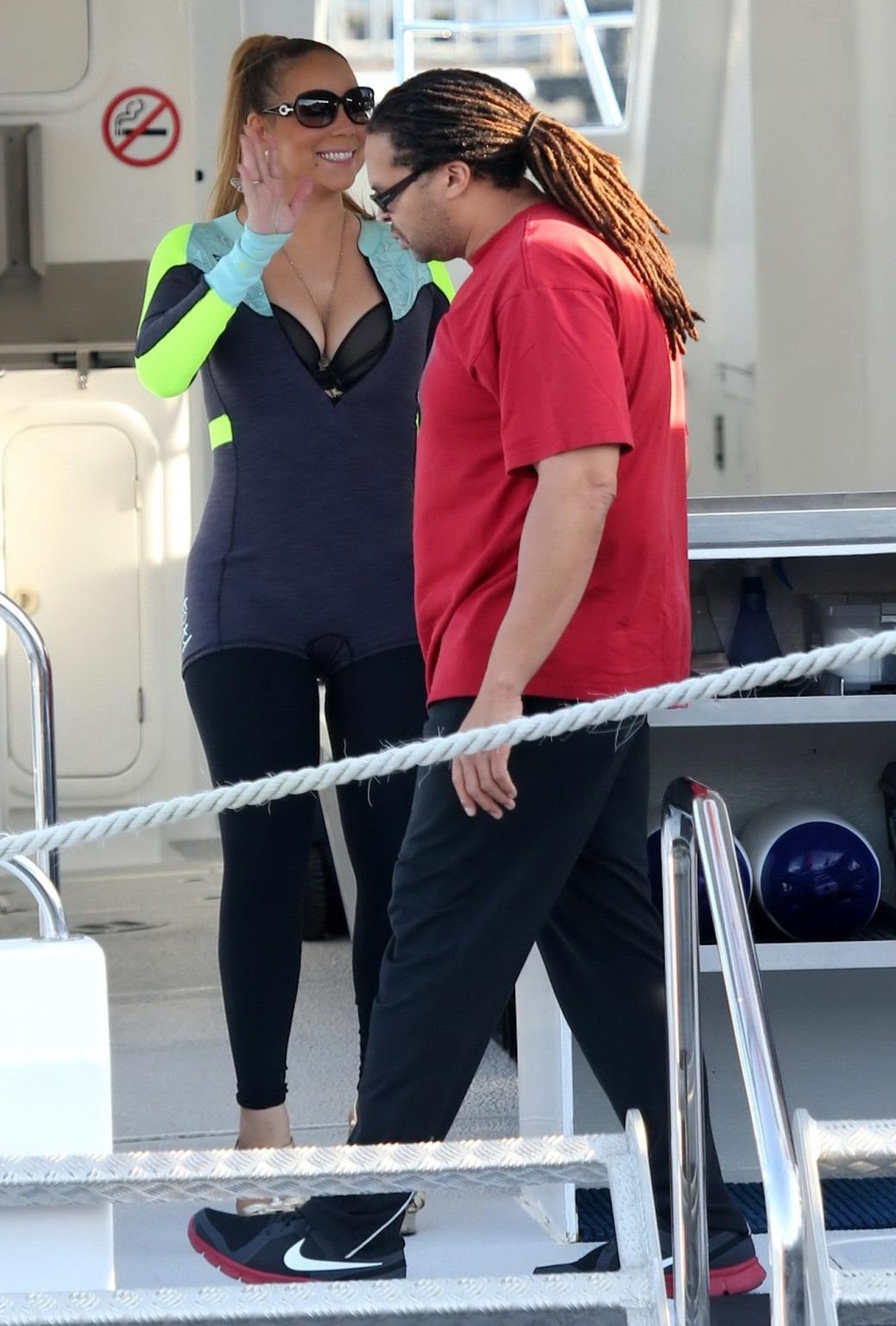 16P Busty Mariah Carey wearing bikini top and wet suit for a boat ride in Perth