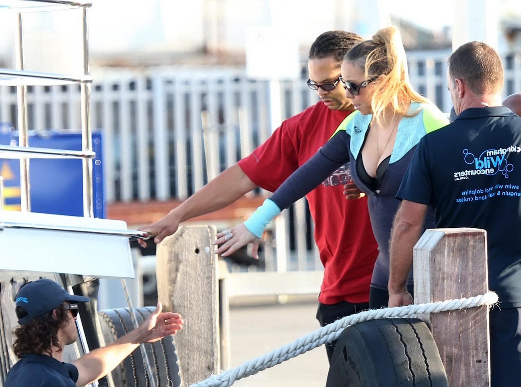 16P Busty Mariah Carey wearing bikini top and wet suit for a boat ride in Perth