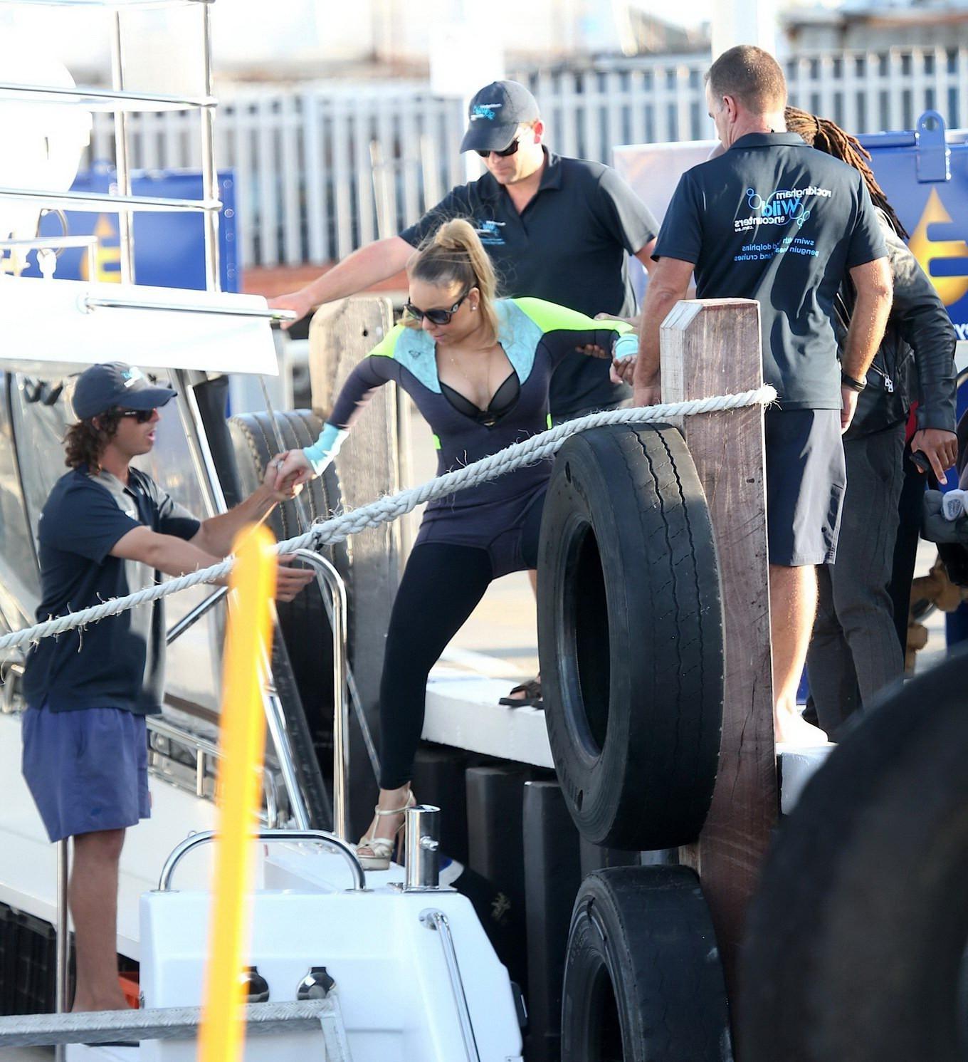 16P Busty Mariah Carey wearing bikini top and wet suit for a boat ride in Perth