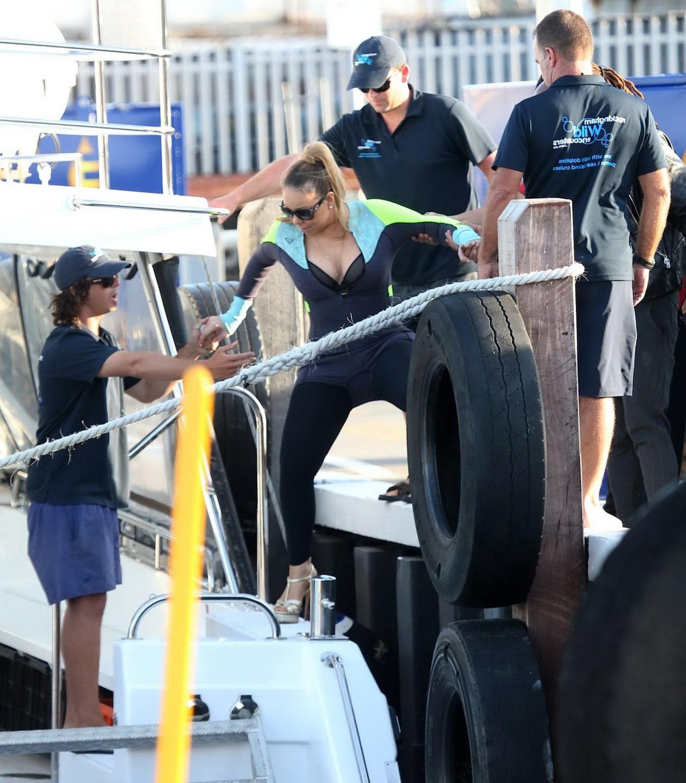 16P Busty Mariah Carey wearing bikini top and wet suit for a boat ride in Perth