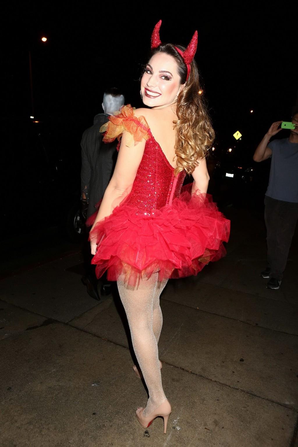 16P Kelly Brook busty and leggy in tiny red devil costume and stockings at Halloween