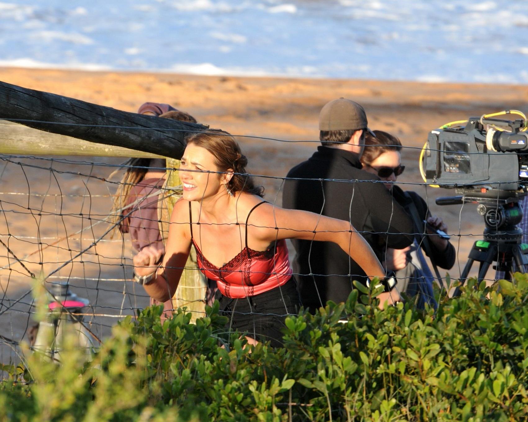 16P Demi Harman wearing a corset and black shorts on Home  Away set at Palm Beach in