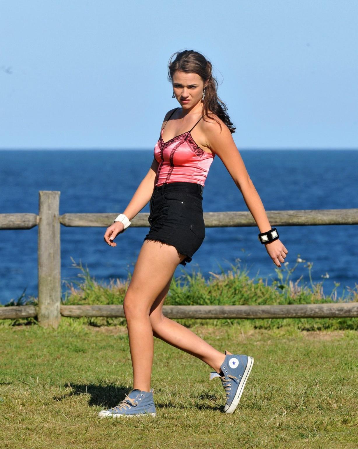 16P Demi Harman wearing a corset and black shorts on Home  Away set at Palm Beach in