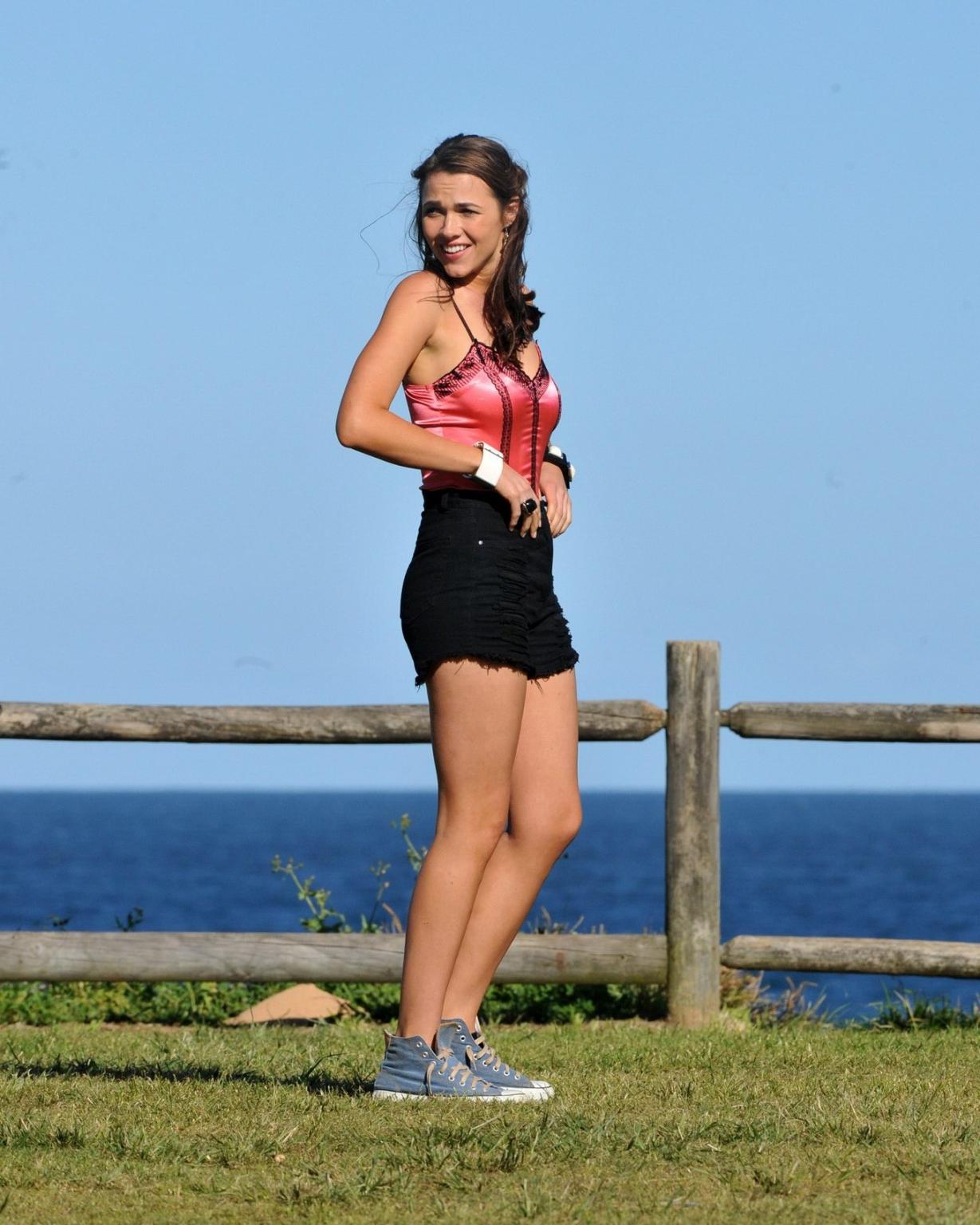 16P Demi Harman wearing a corset and black shorts on Home  Away set at Palm Beach in