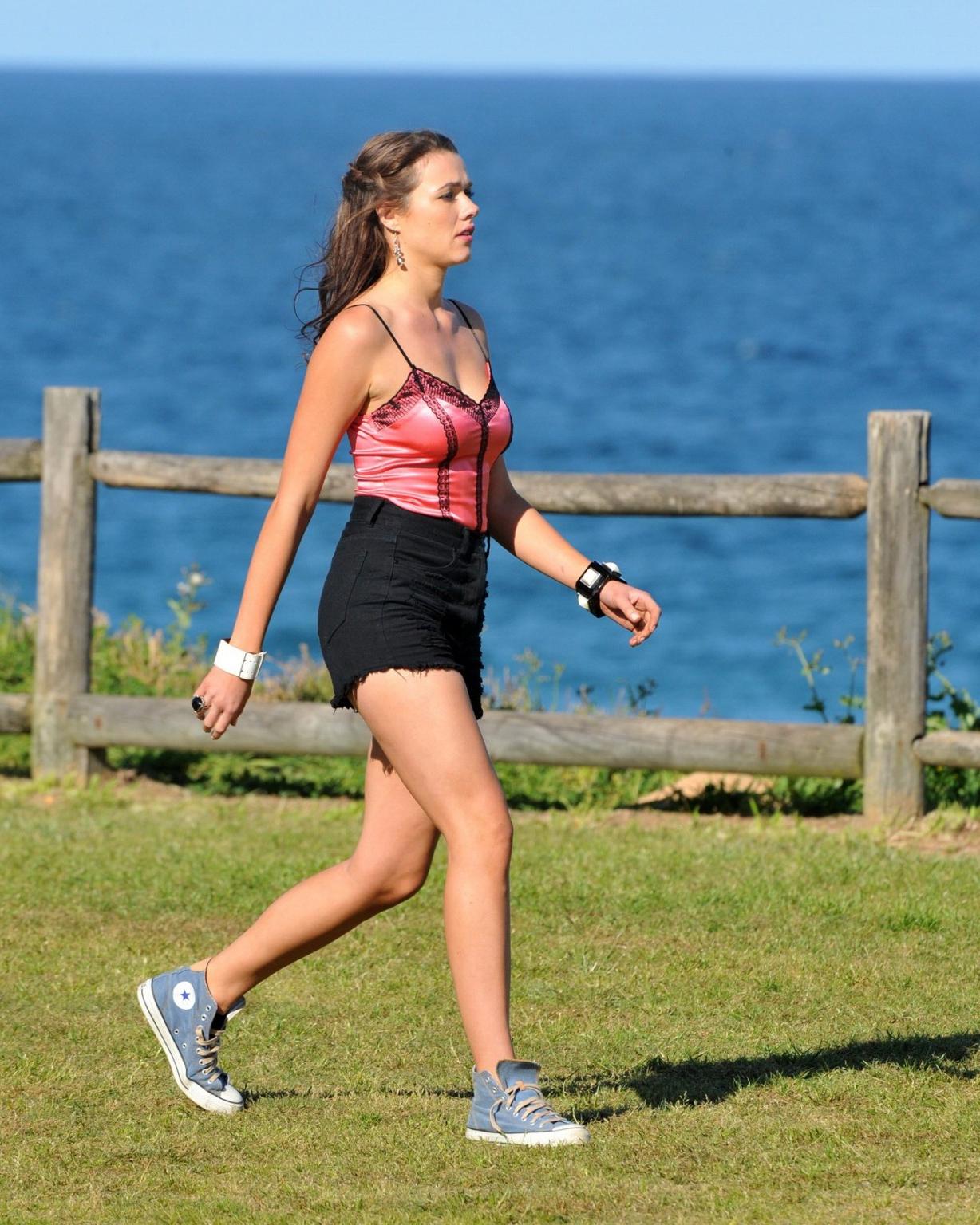 16P Demi Harman wearing a corset and black shorts on Home  Away set at Palm Beach in