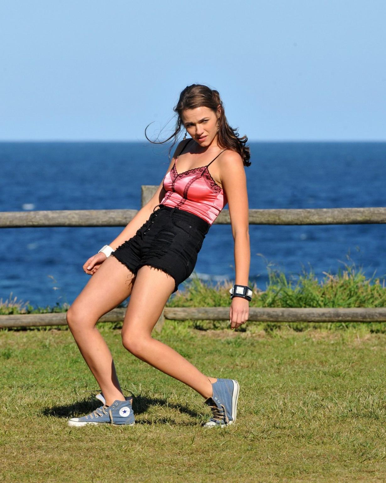 16P Demi Harman wearing a corset and black shorts on Home  Away set at Palm Beach in