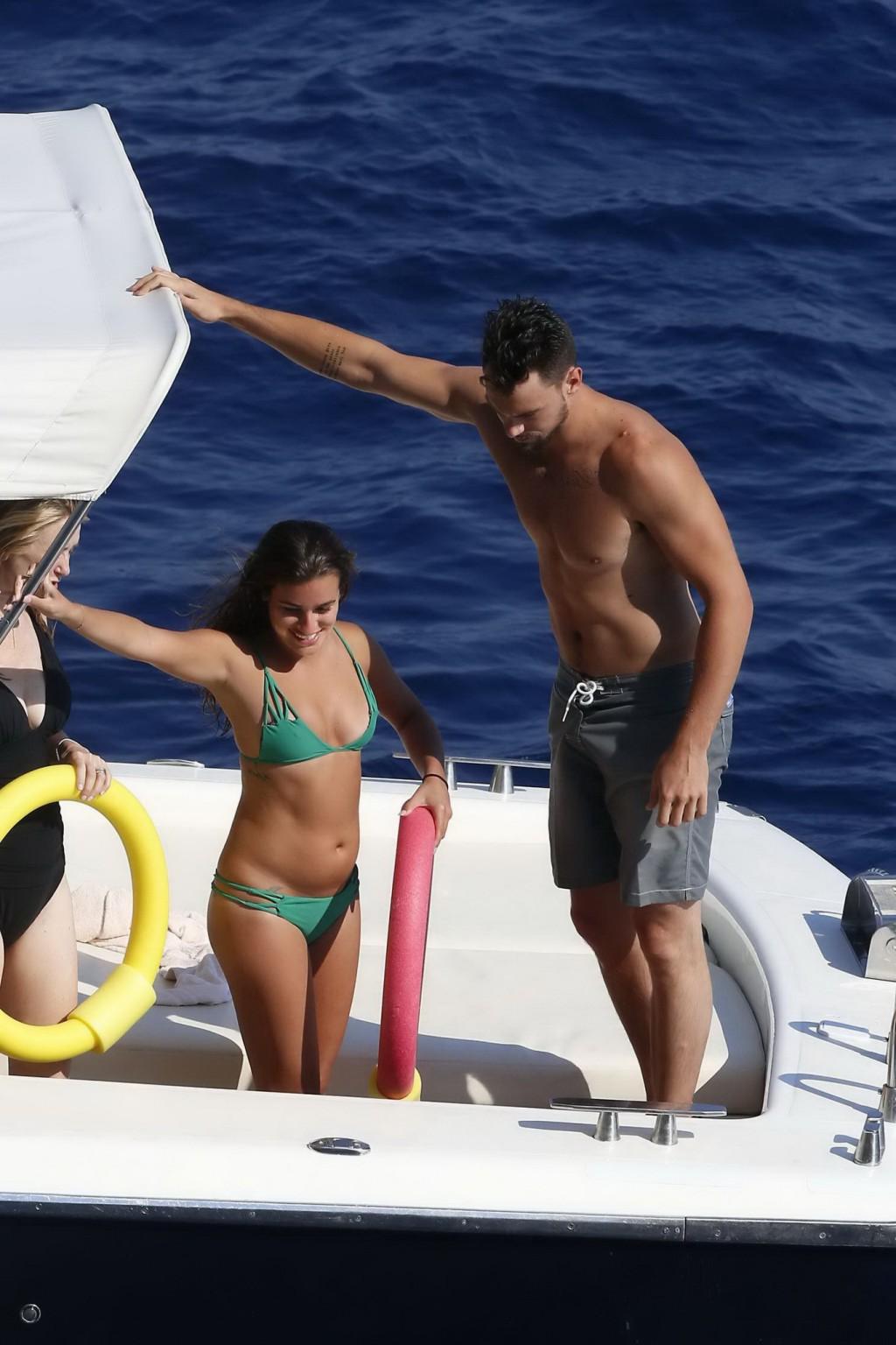 16P Lea Michele nipple slip from her tiny green bikini on the boat during a vacation