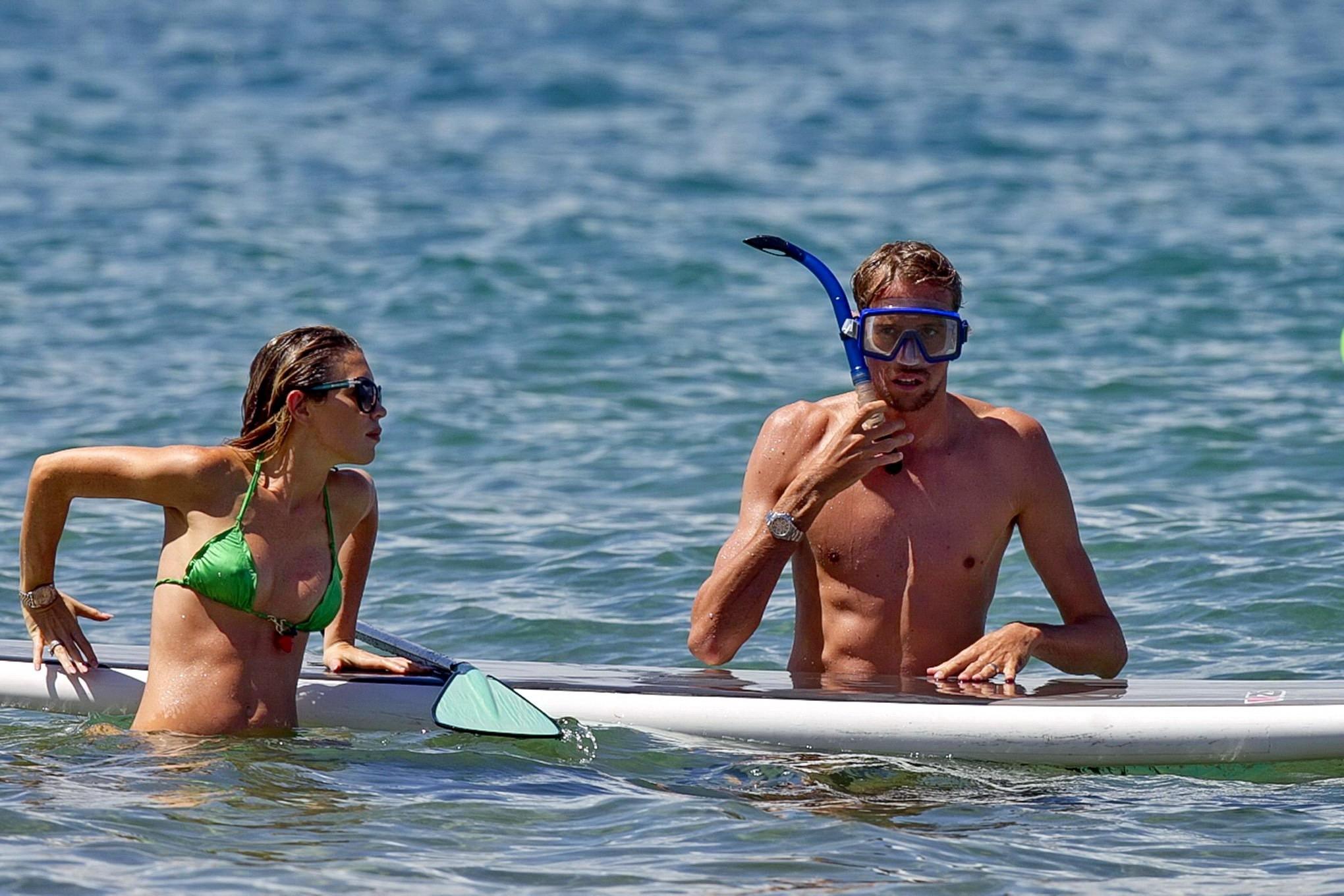 16P Abigail Clancy showing off her bikini body while paddleboarding on a Hawaiian be
