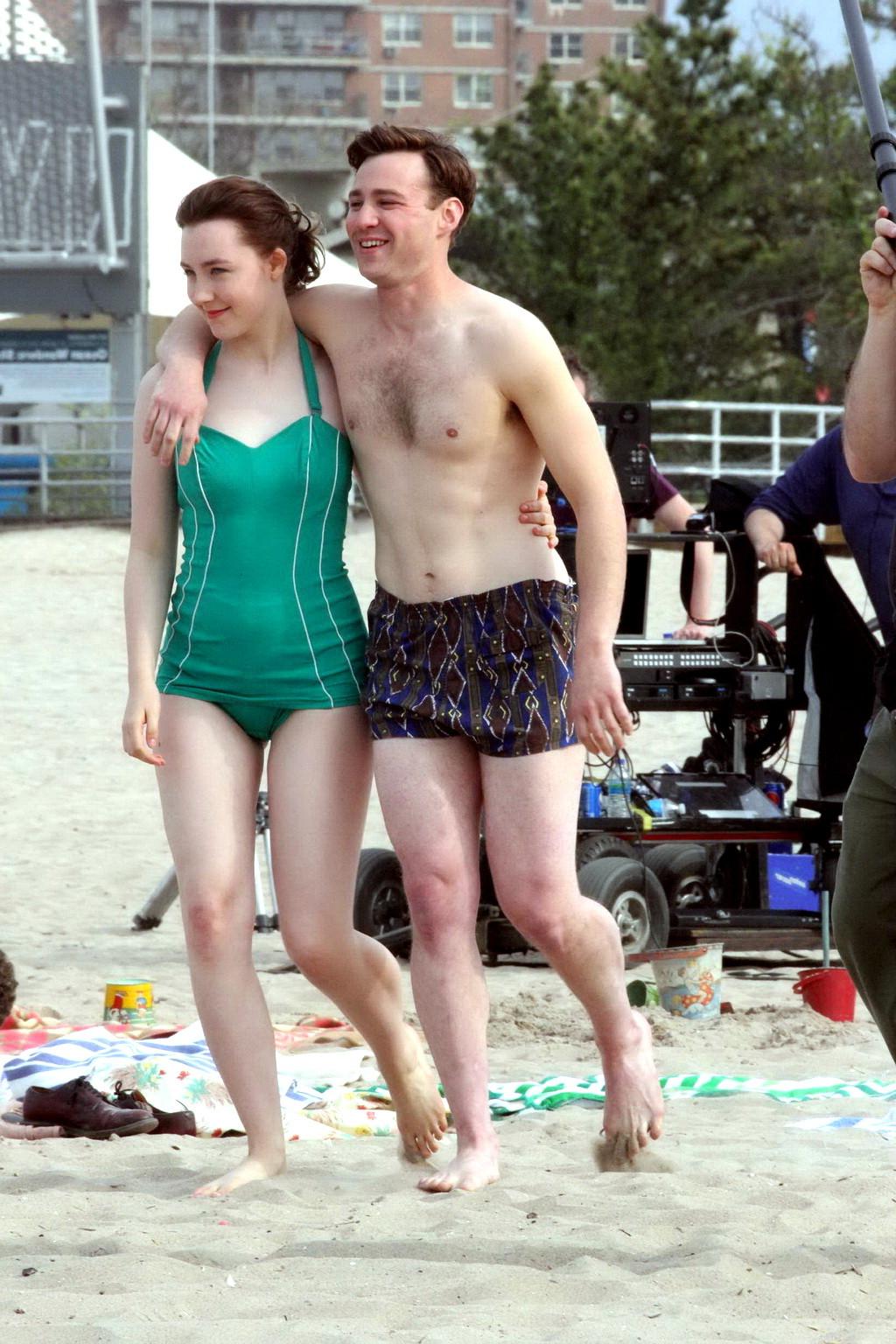 16P Saoirse Ronan booty wearing retro green swimsuit at the beach in New York