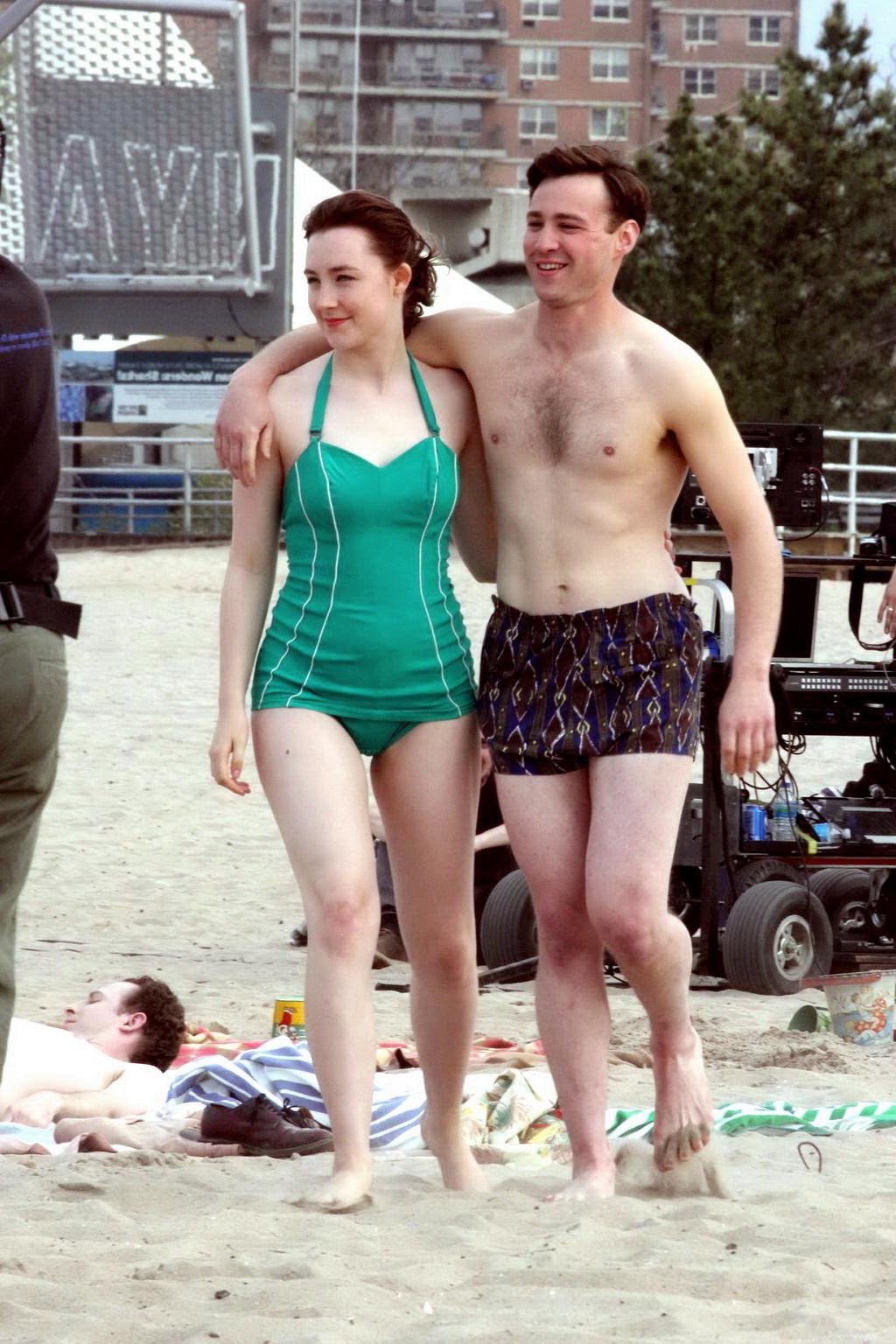16P Saoirse Ronan booty wearing retro green swimsuit at the beach in New York