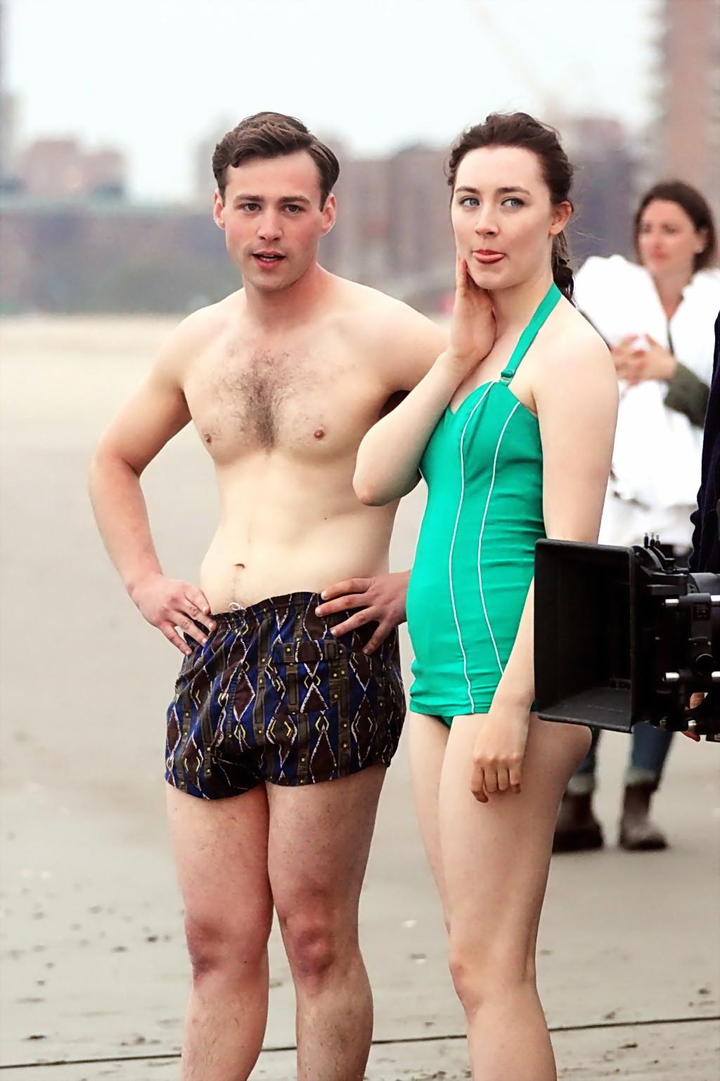 16P Saoirse Ronan booty wearing retro green swimsuit at the beach in New York