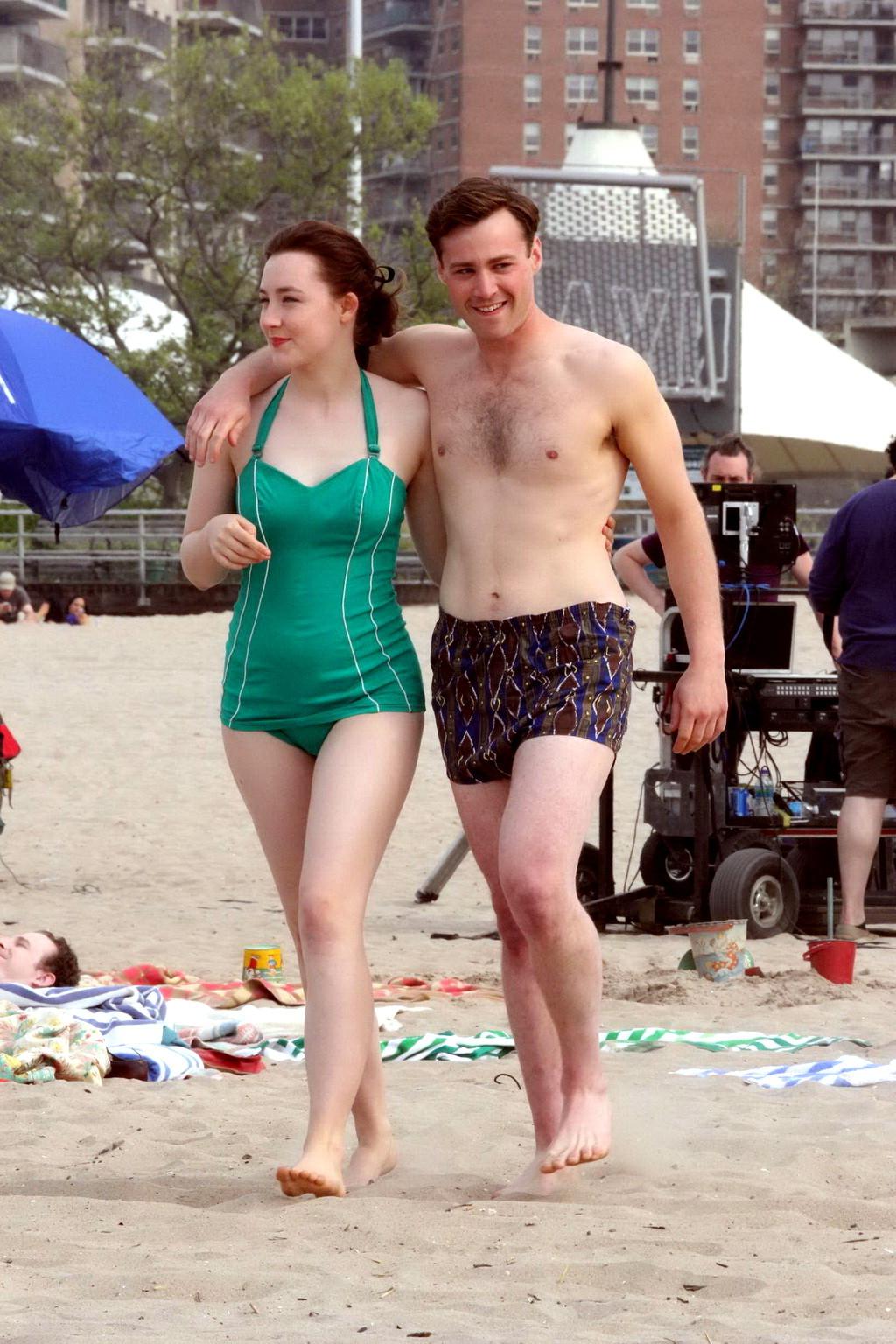 16P Saoirse Ronan booty wearing retro green swimsuit at the beach in New York