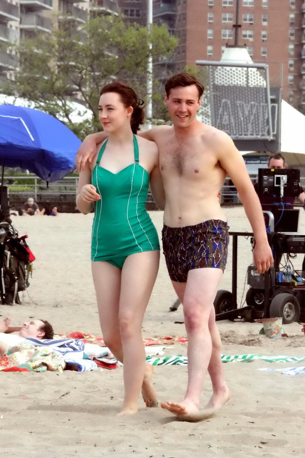 16P Saoirse Ronan booty wearing retro green swimsuit at the beach in New York