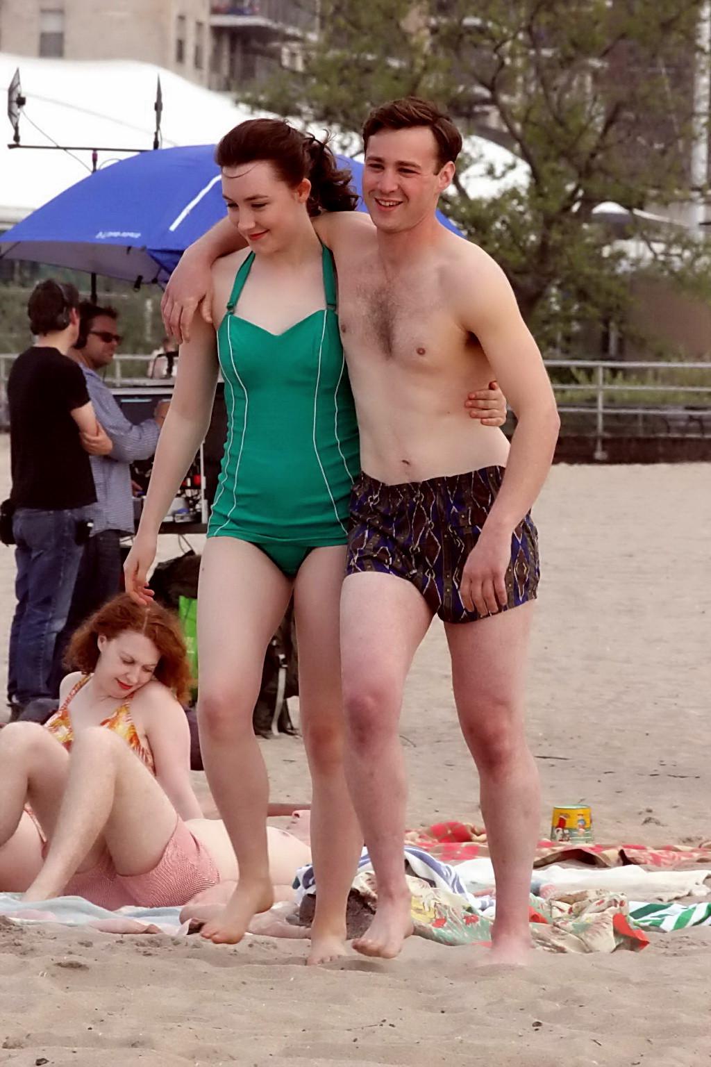 16P Saoirse Ronan booty wearing retro green swimsuit at the beach in New York