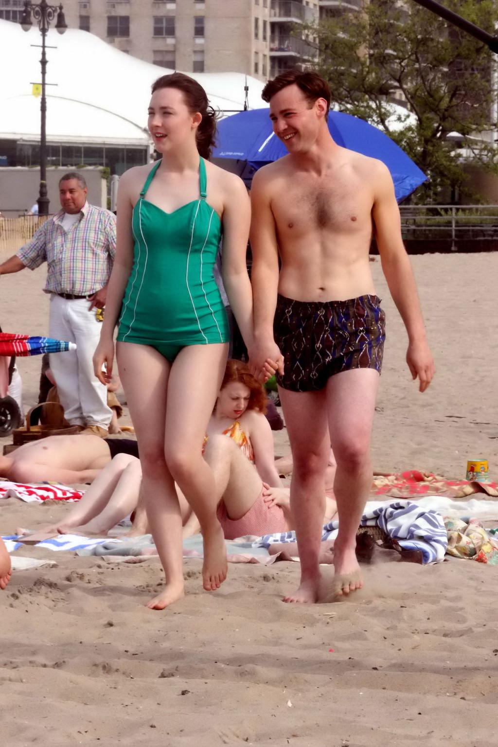 16P Saoirse Ronan booty wearing retro green swimsuit at the beach in New York