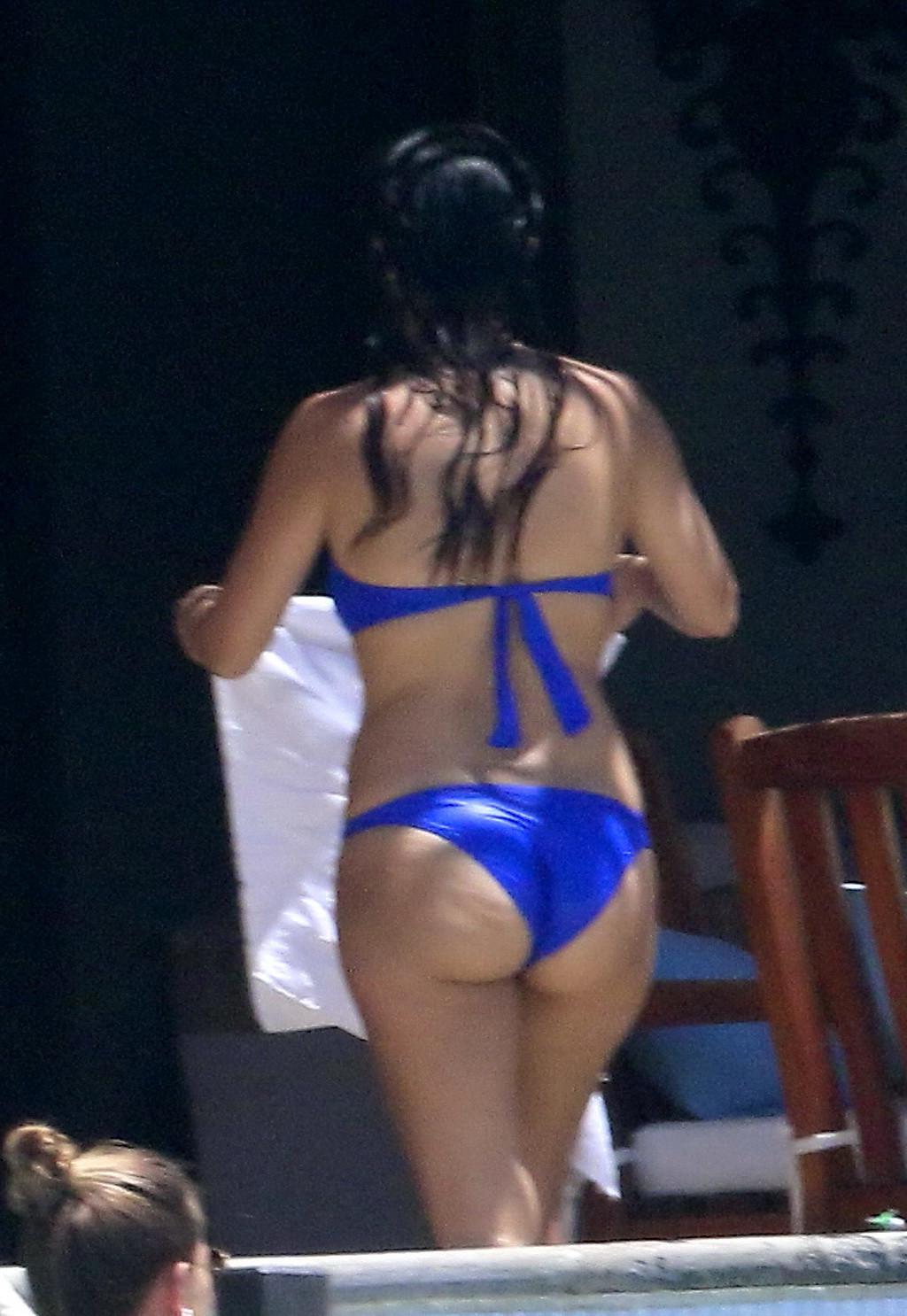 16P Kourtney Kardashian wearing blue tube bikini poolside in Mexico