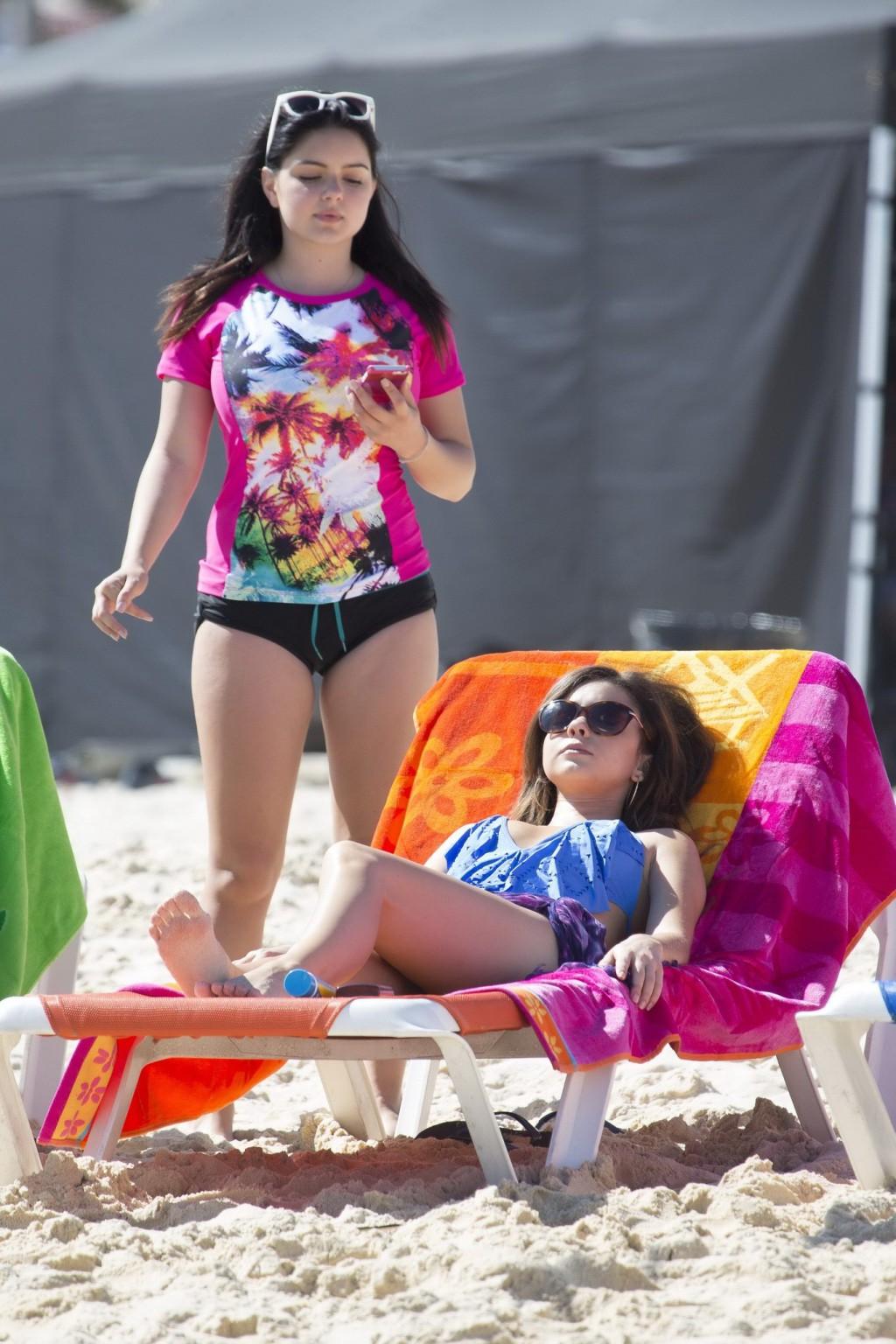 16P Sarah Hyland busty wearing skimpy blue monokini while filming Modern Family on B