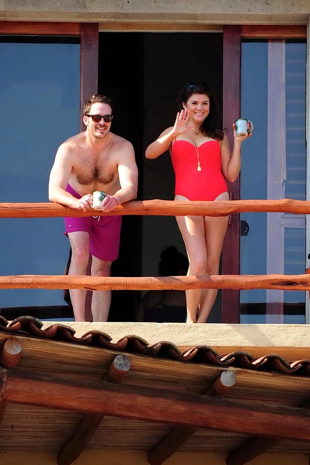 16P Busty Tiffani Amber Thiessen wearing a red swimsuit on a beach in Mexico