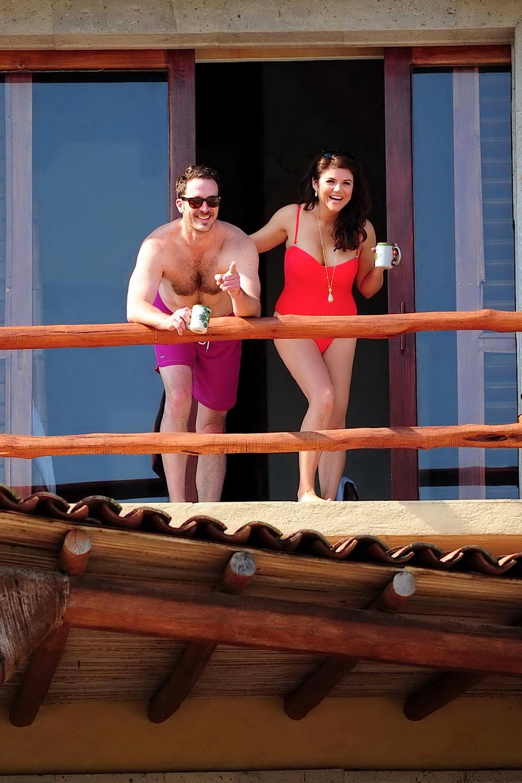 16P Busty Tiffani Amber Thiessen wearing a red swimsuit on a beach in Mexico