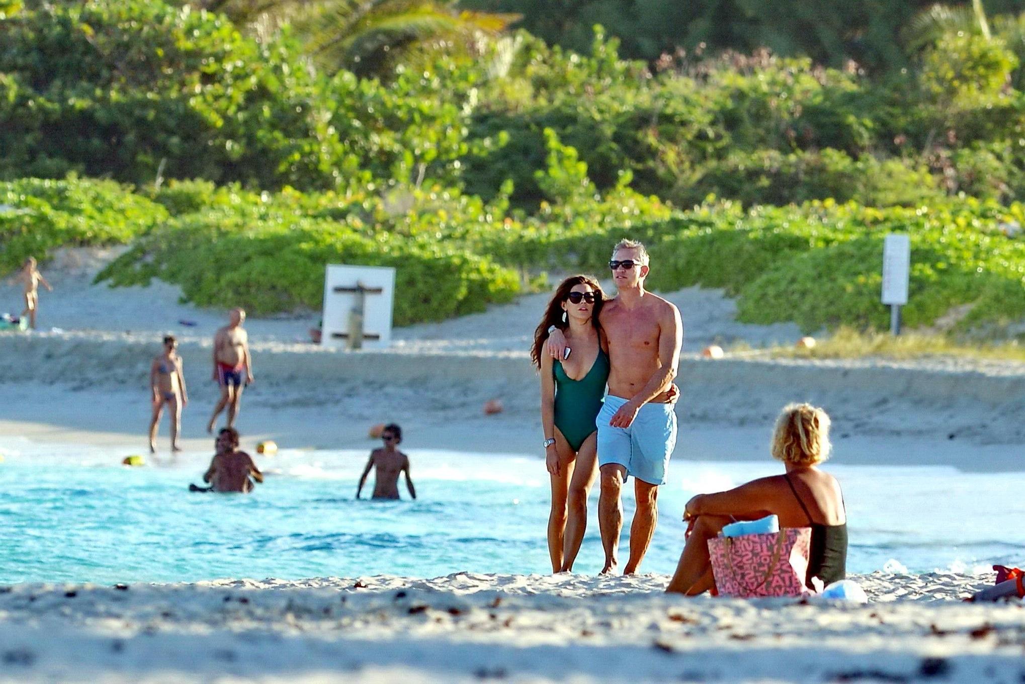 16P Danielle Lineker nipple slip wearing a skimpy green swimsuit on a beach in St. B