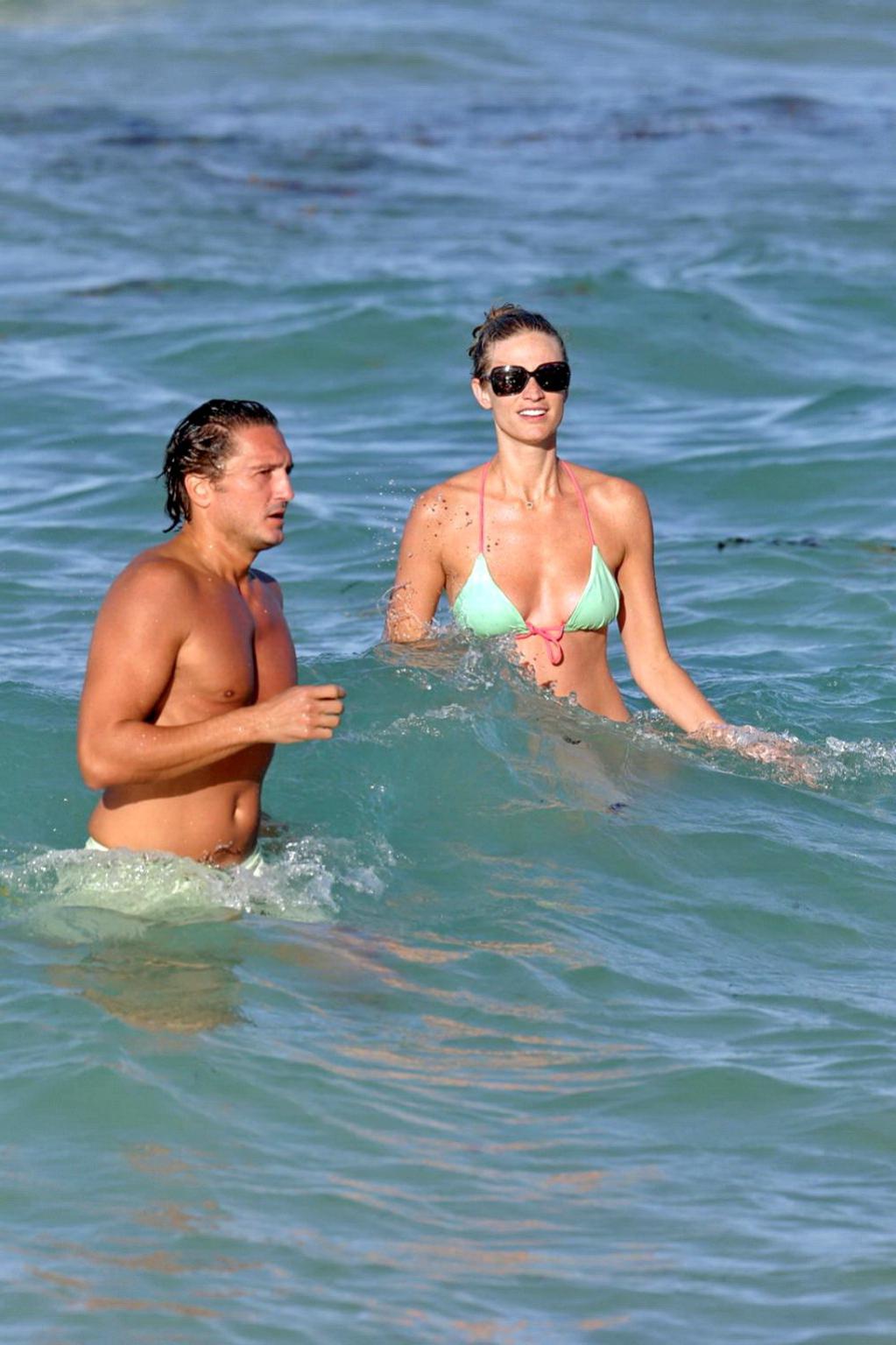 16P Julie Henderson wearing a light blue bikini on a beach in Miami