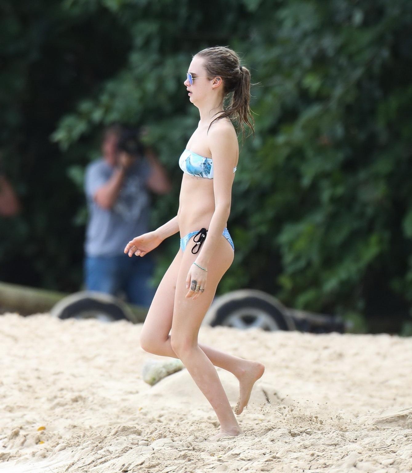 16P Cara Delevigne wearing tiny blue tube bikini at the beach in Barbados