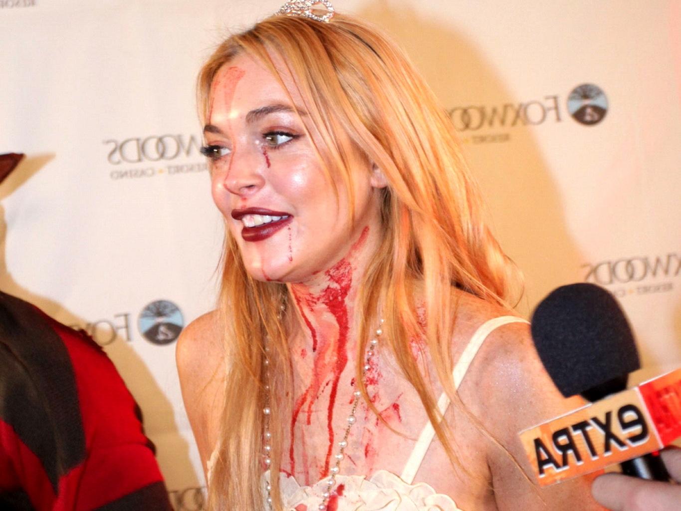 16P Lindsay Lohan in Carrie costume hosting a Halloween party at Foxwoods Resort Cas