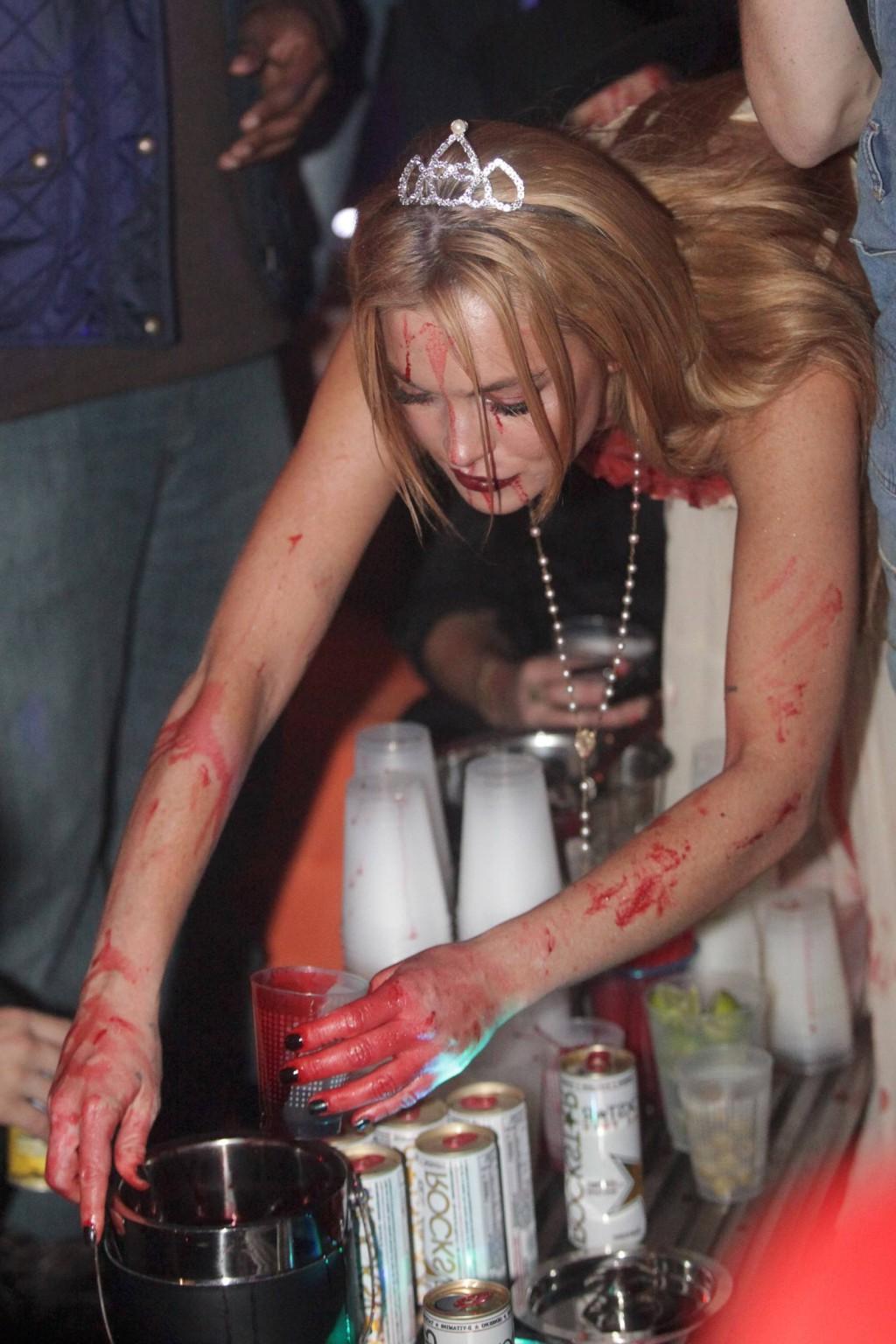 16P Lindsay Lohan in Carrie costume hosting a Halloween party at Foxwoods Resort Cas