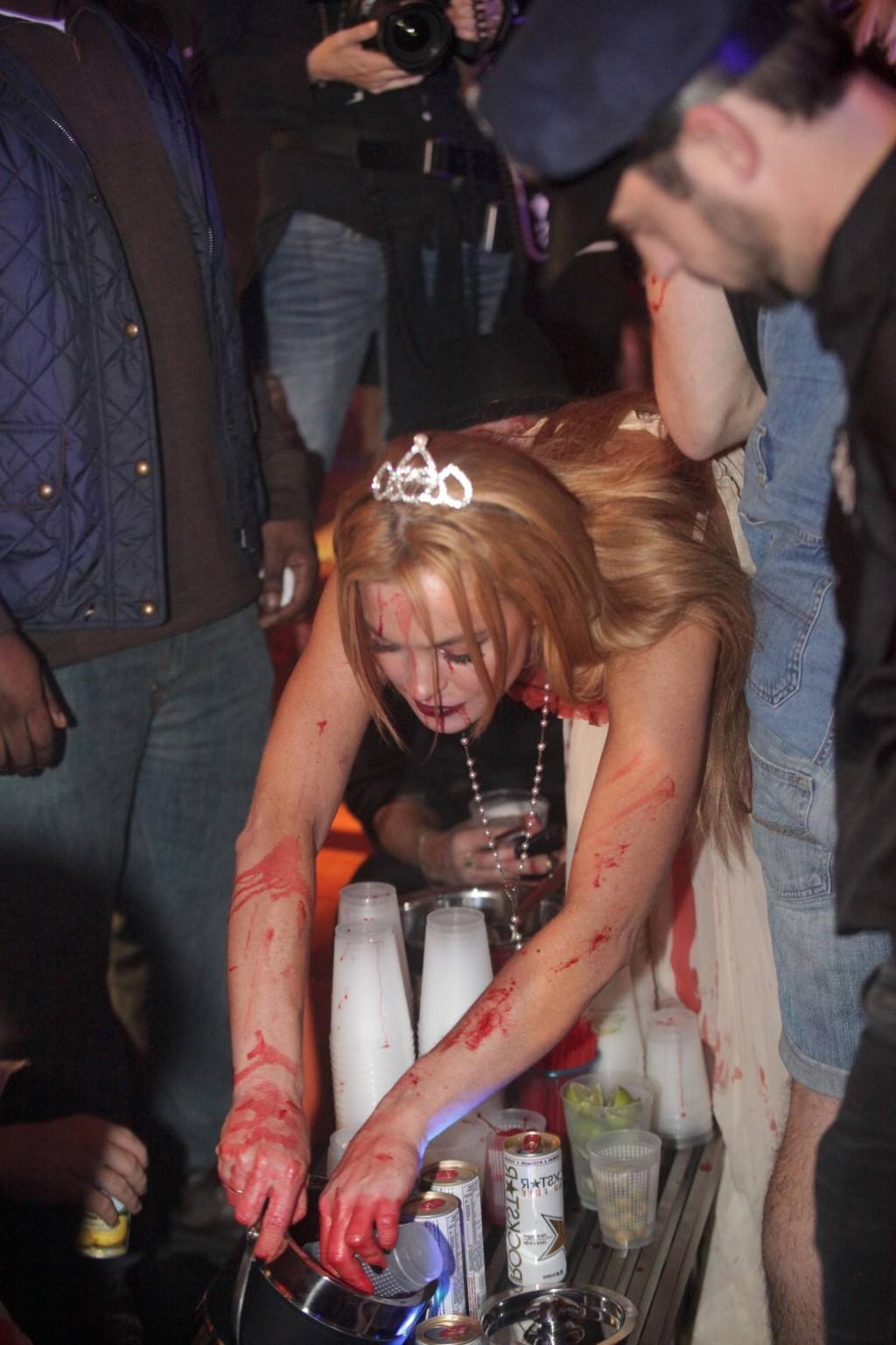 16P Lindsay Lohan in Carrie costume hosting a Halloween party at Foxwoods Resort Cas