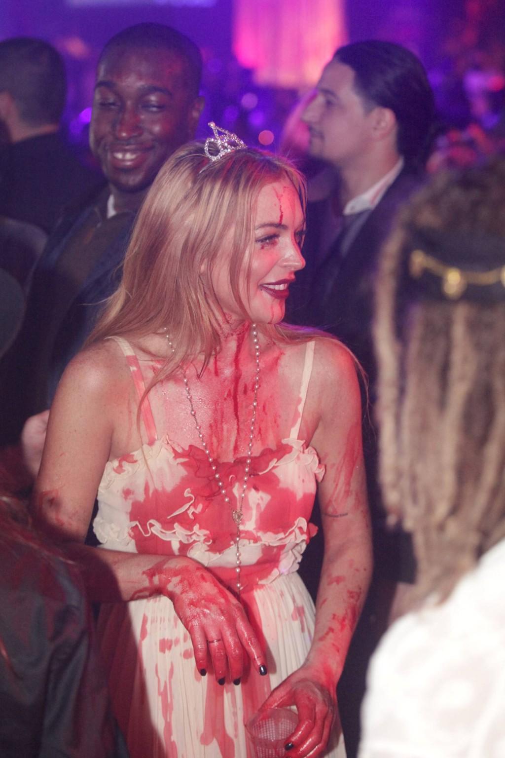 16P Lindsay Lohan in Carrie costume hosting a Halloween party at Foxwoods Resort Cas