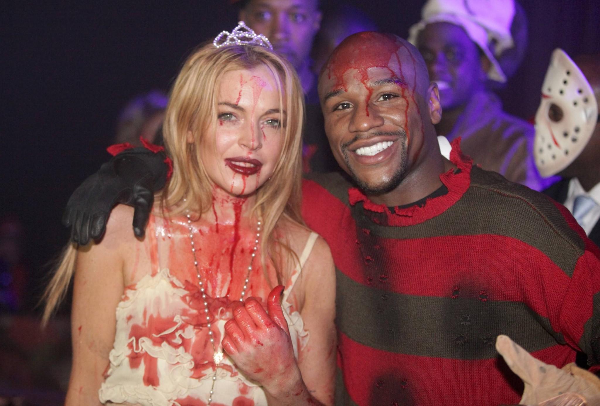 16P Lindsay Lohan in Carrie costume hosting a Halloween party at Foxwoods Resort Cas