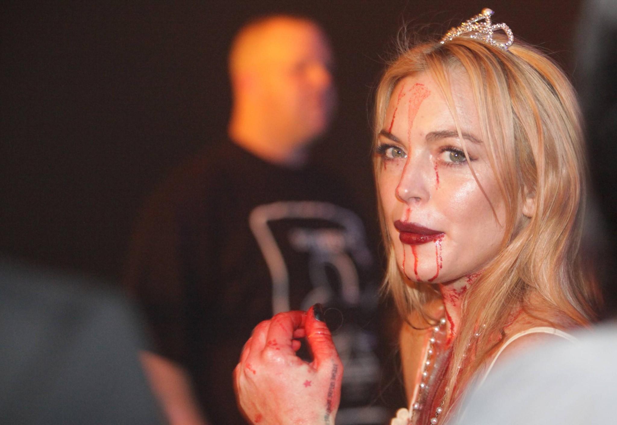 16P Lindsay Lohan in Carrie costume hosting a Halloween party at Foxwoods Resort Cas