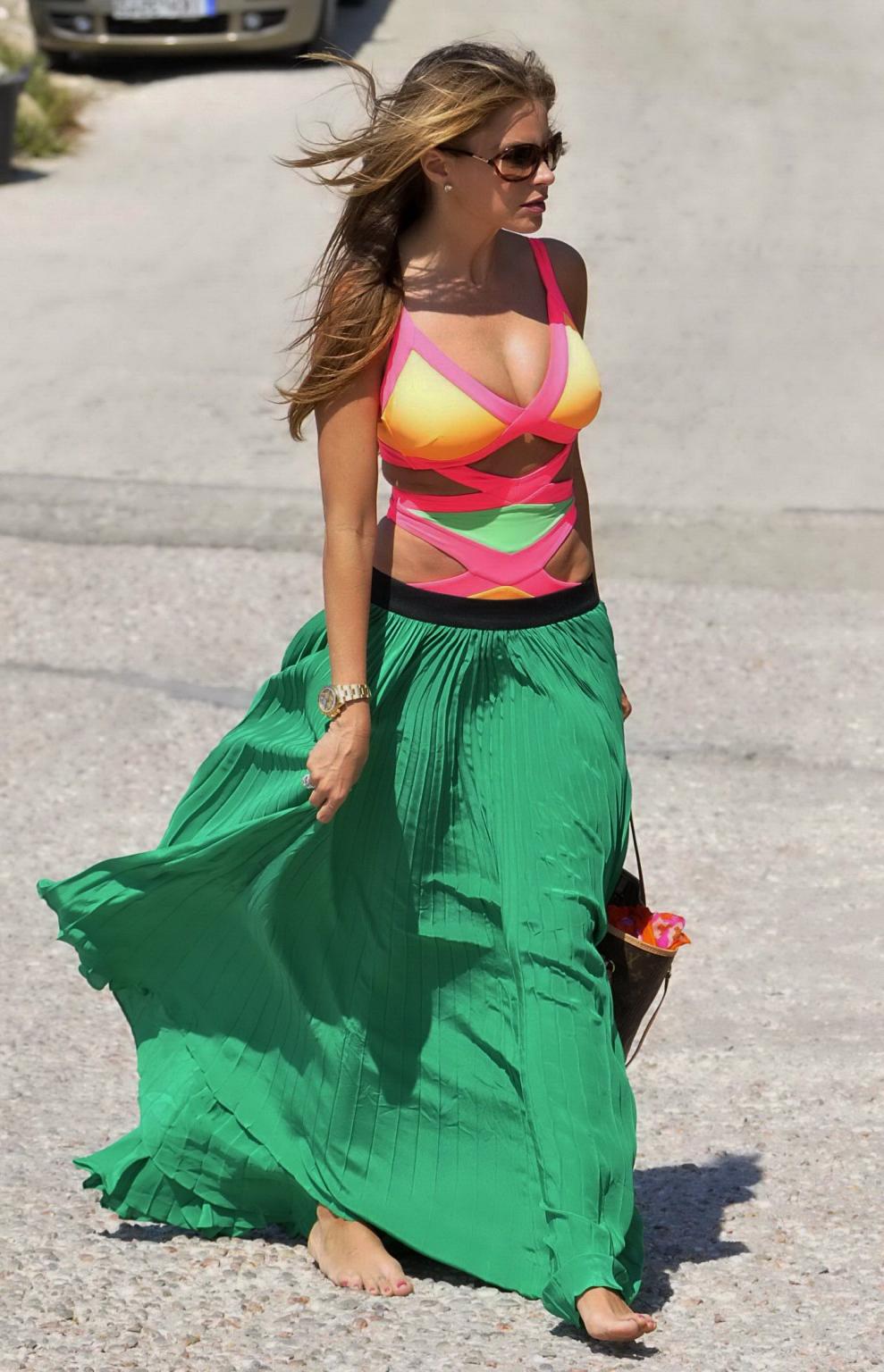 16P Sofia Vergara showing off her bust line in a colorful swimsuit at the beach in M