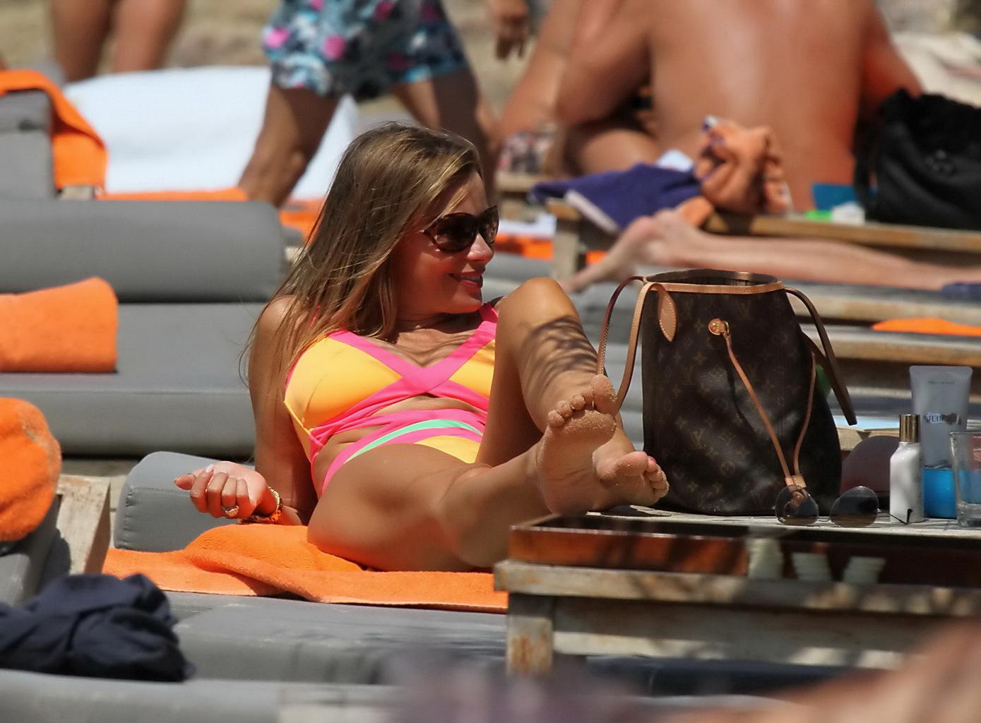 16P Sofia Vergara showing off her bust line in a colorful swimsuit at the beach in M
