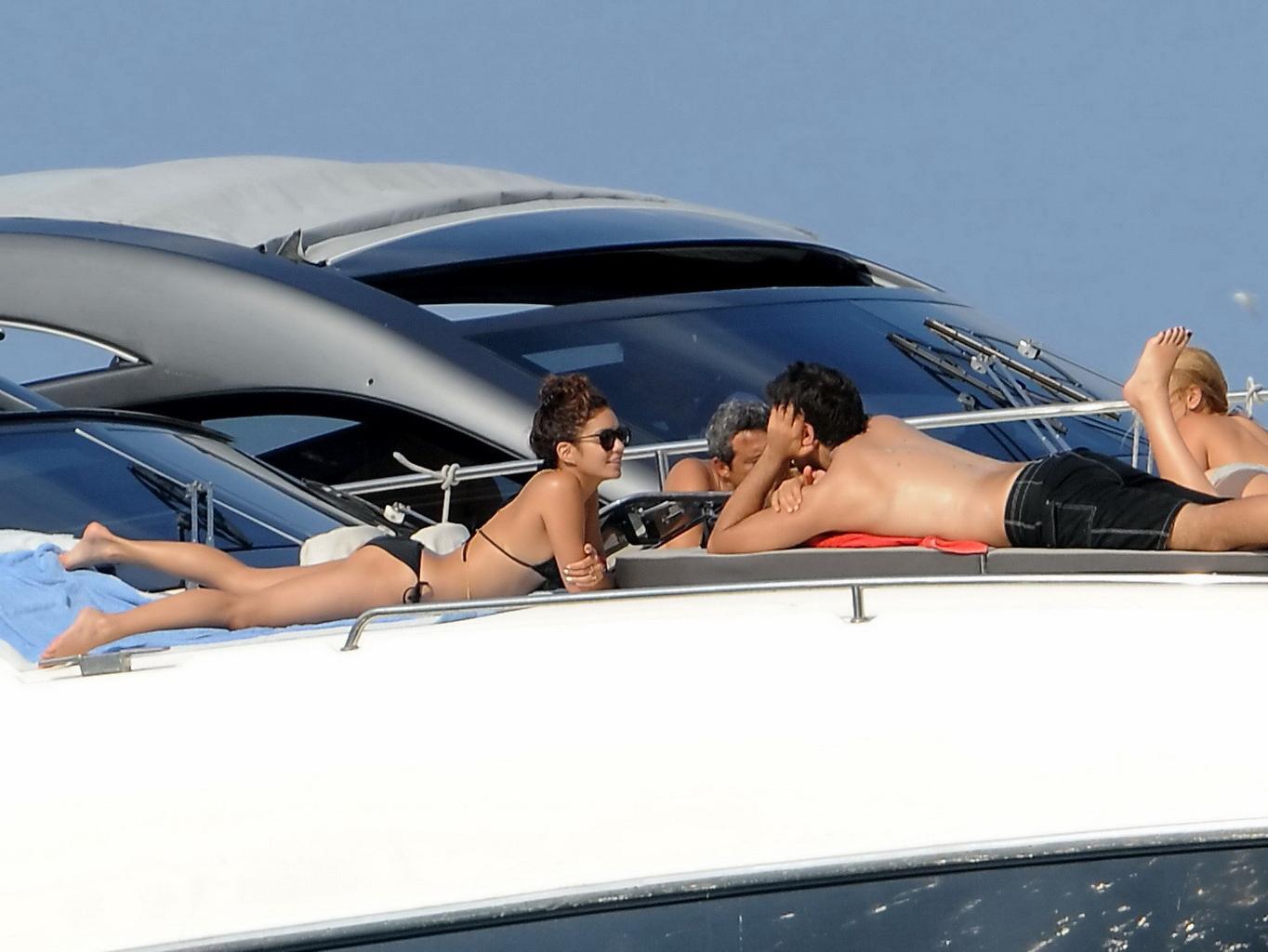 16P Vanessa Hudgens in black bikini doing yoga on a boat in Ischia, Italy