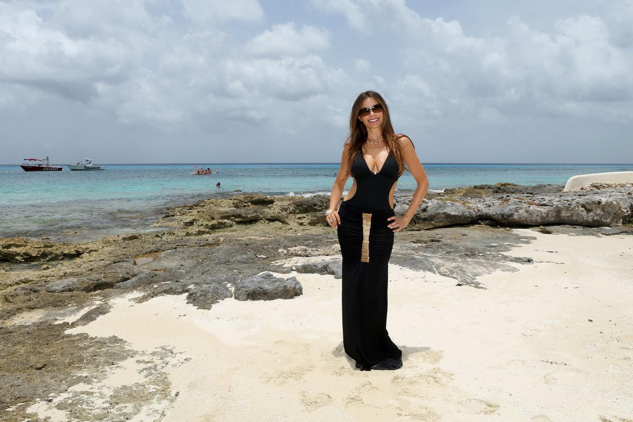 16P Sofia Vergara shows off her huge assets wearing skimpy black swimsuit at the Myk