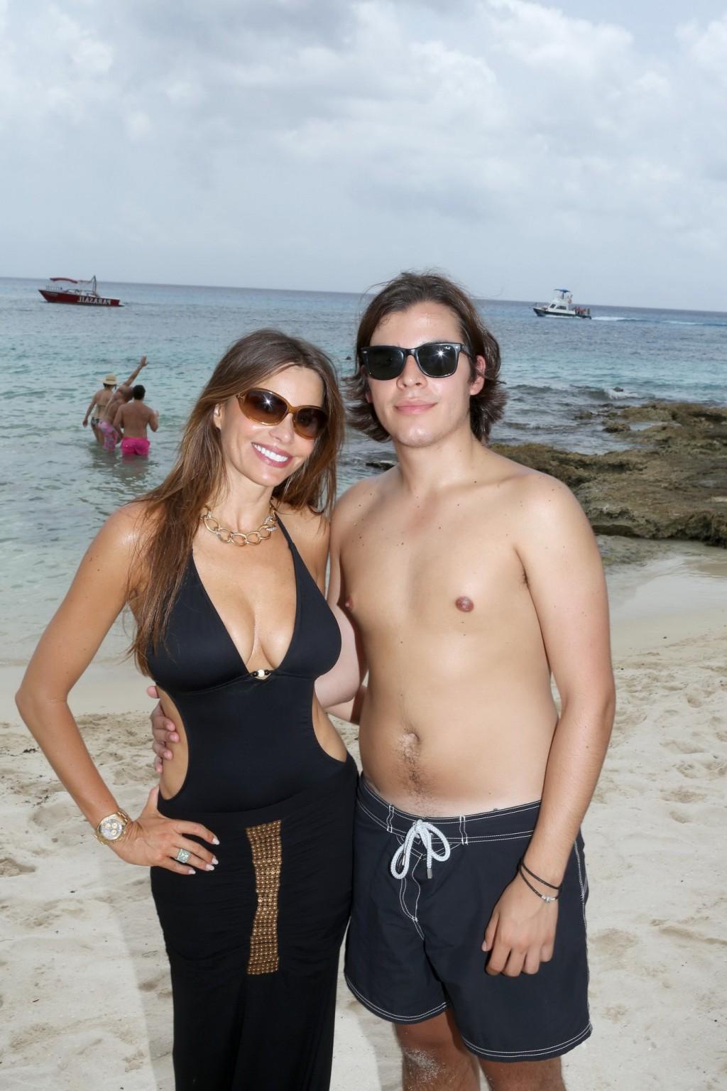 16P Sofia Vergara shows off her huge assets wearing skimpy black swimsuit at the Myk