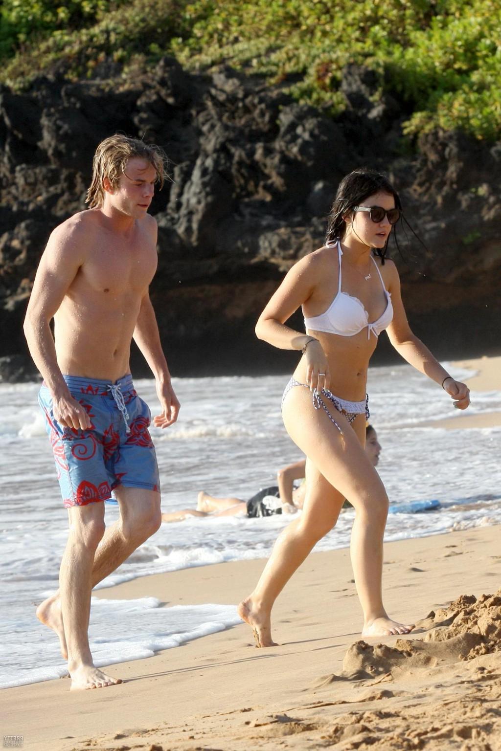 16P Lucy Hale shows off her round ass wearing a bikini on a Hawaiian beach
