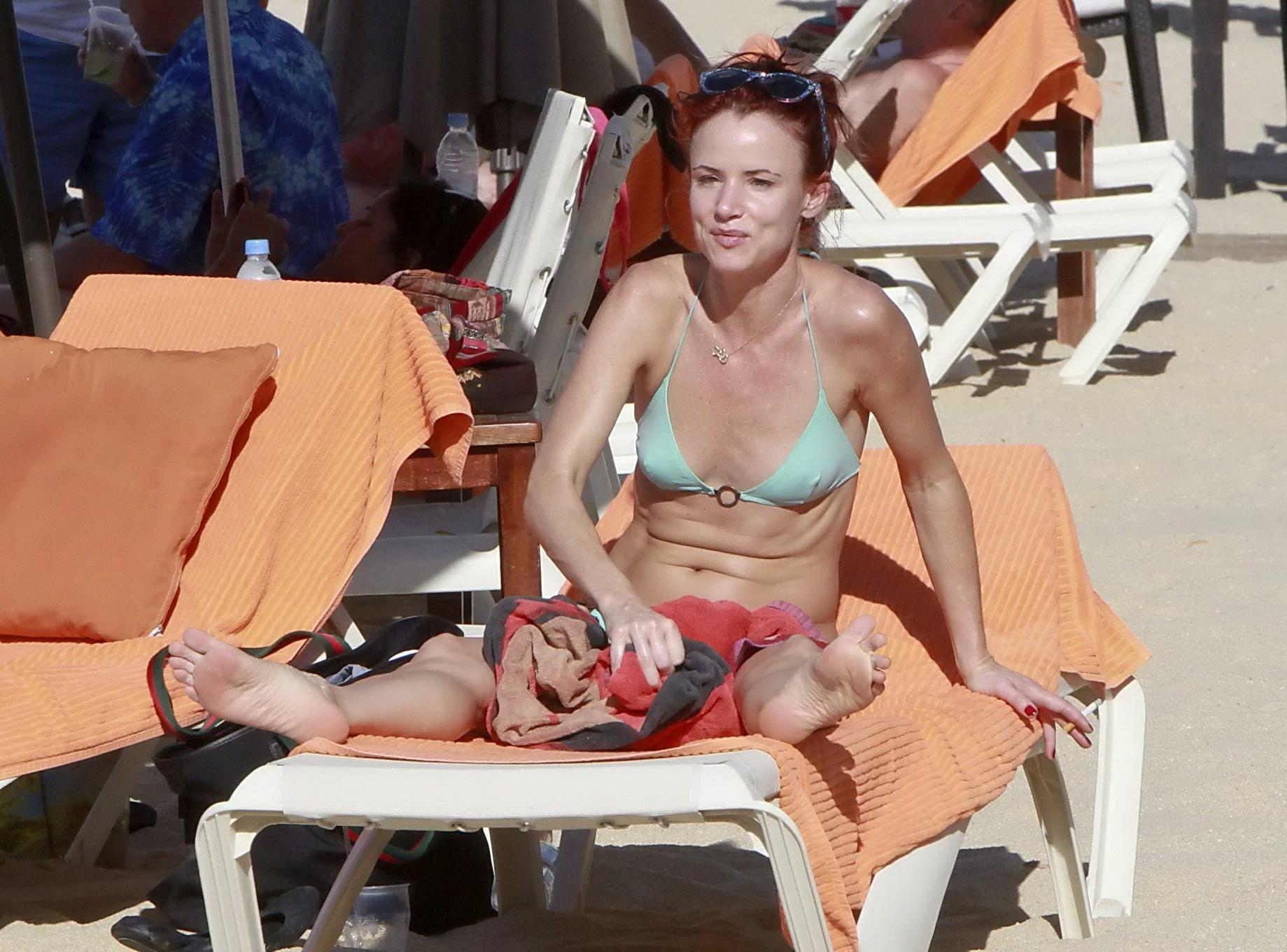16P Juliette Lewis wearing skimpy light blue bikini at the beach in Mexico