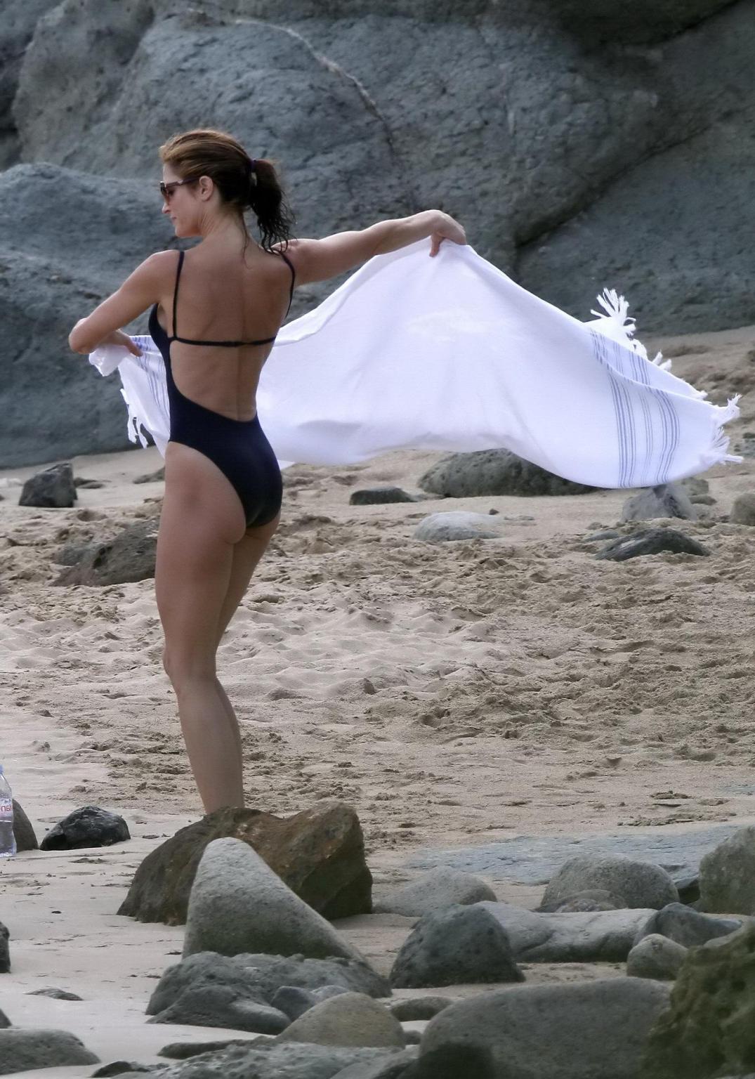 10P Stephanie Seymour shows off her curvy body wearing a navy blue swimsuit in St. B