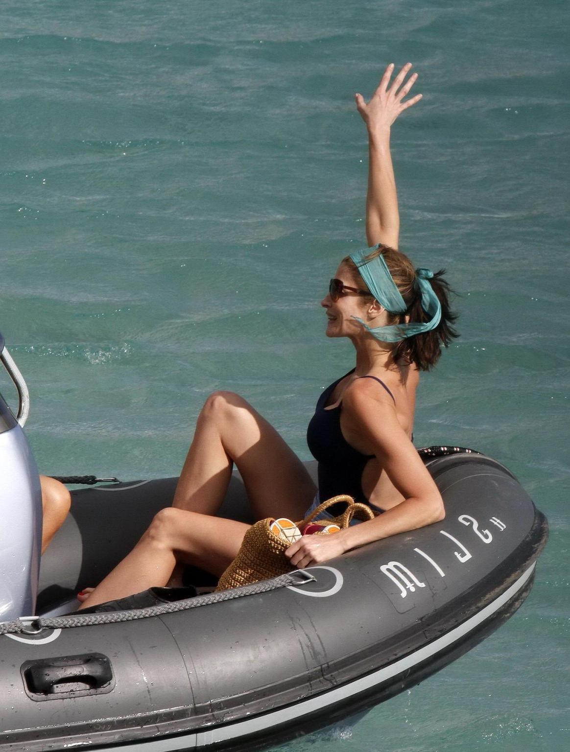 10P Stephanie Seymour shows off her curvy body wearing a navy blue swimsuit in St. B